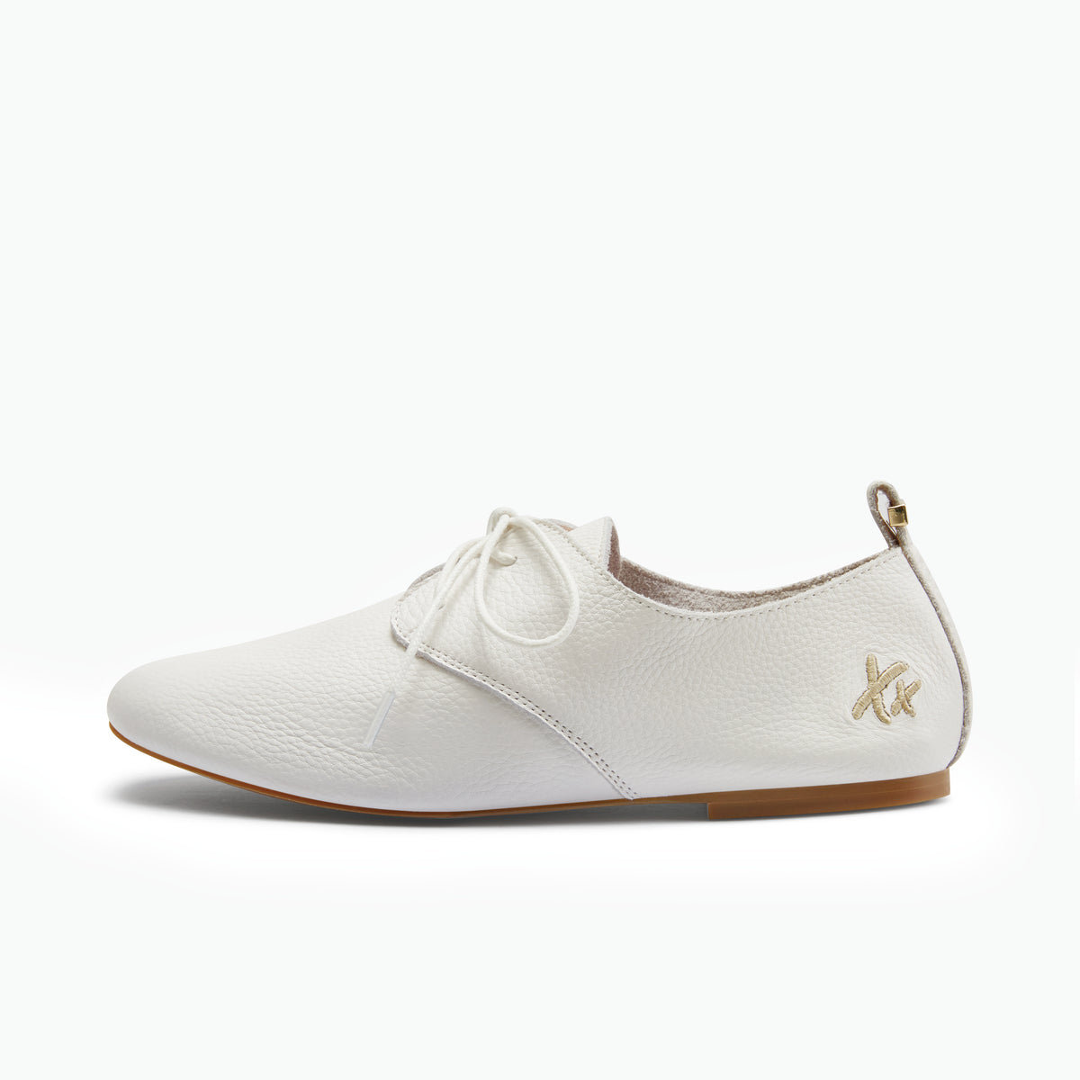 A white pebbled leather lace-up shoe with a small gold logo on the heel, shown in a side profile against a clean white background.