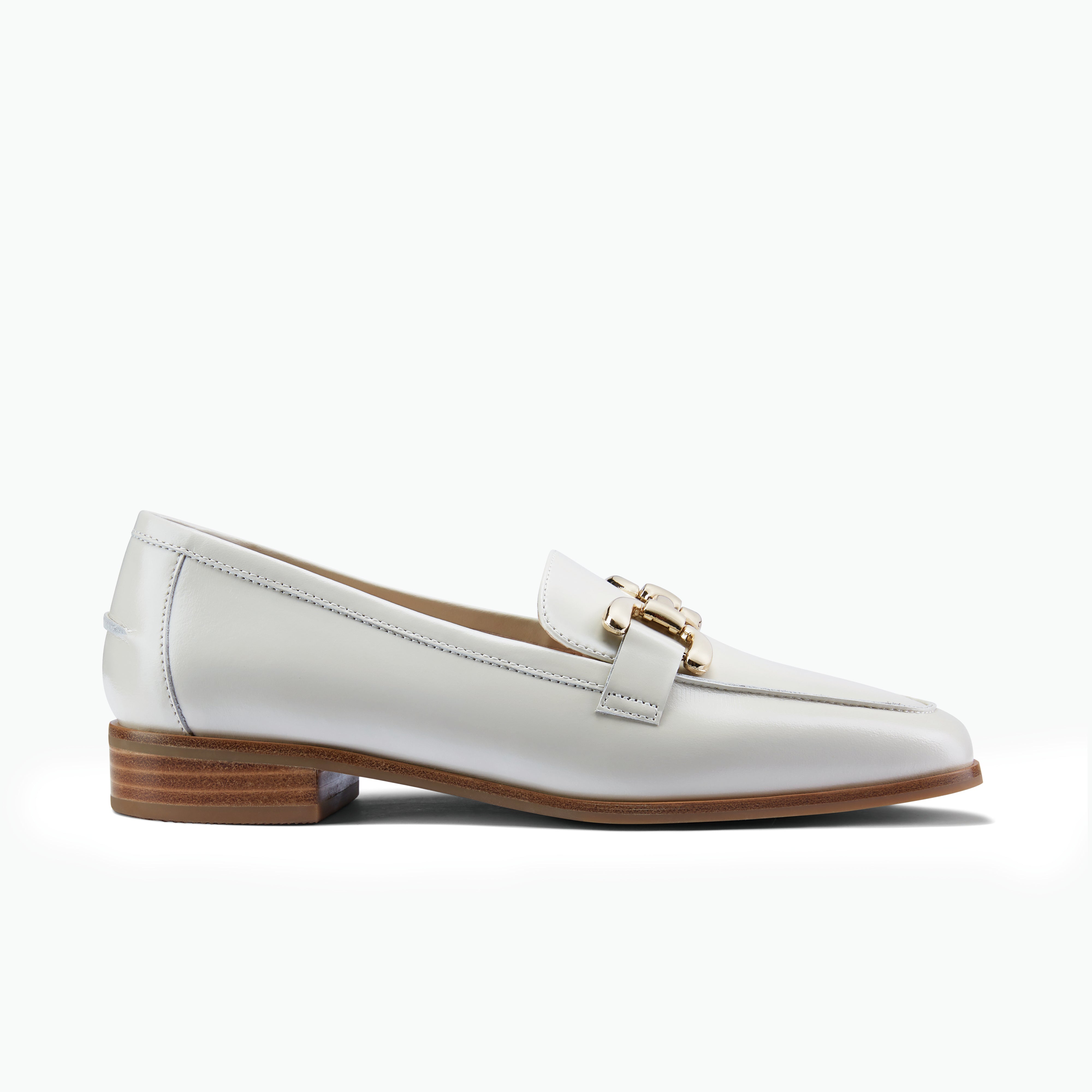Alisa ivory oiled leather loafer with chunky gold buckle and stacked leather heel profile view.