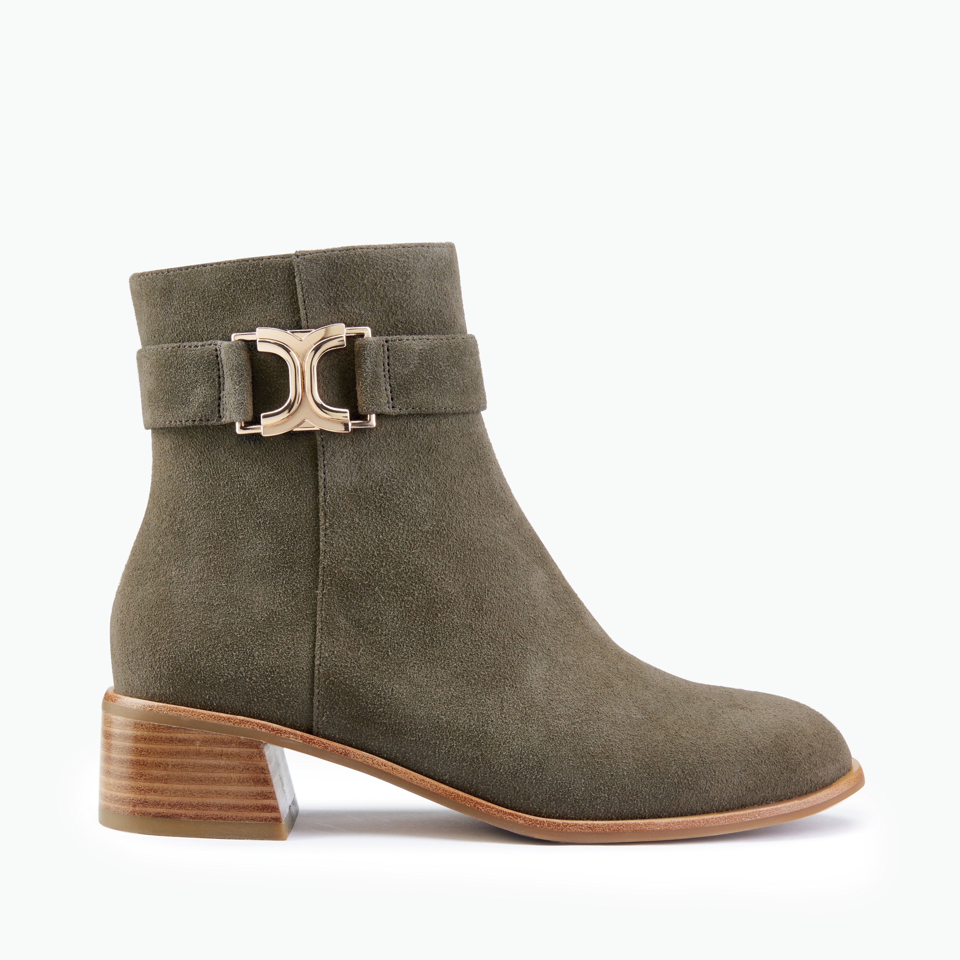 Green ankle boot with a gold buckle on a white background