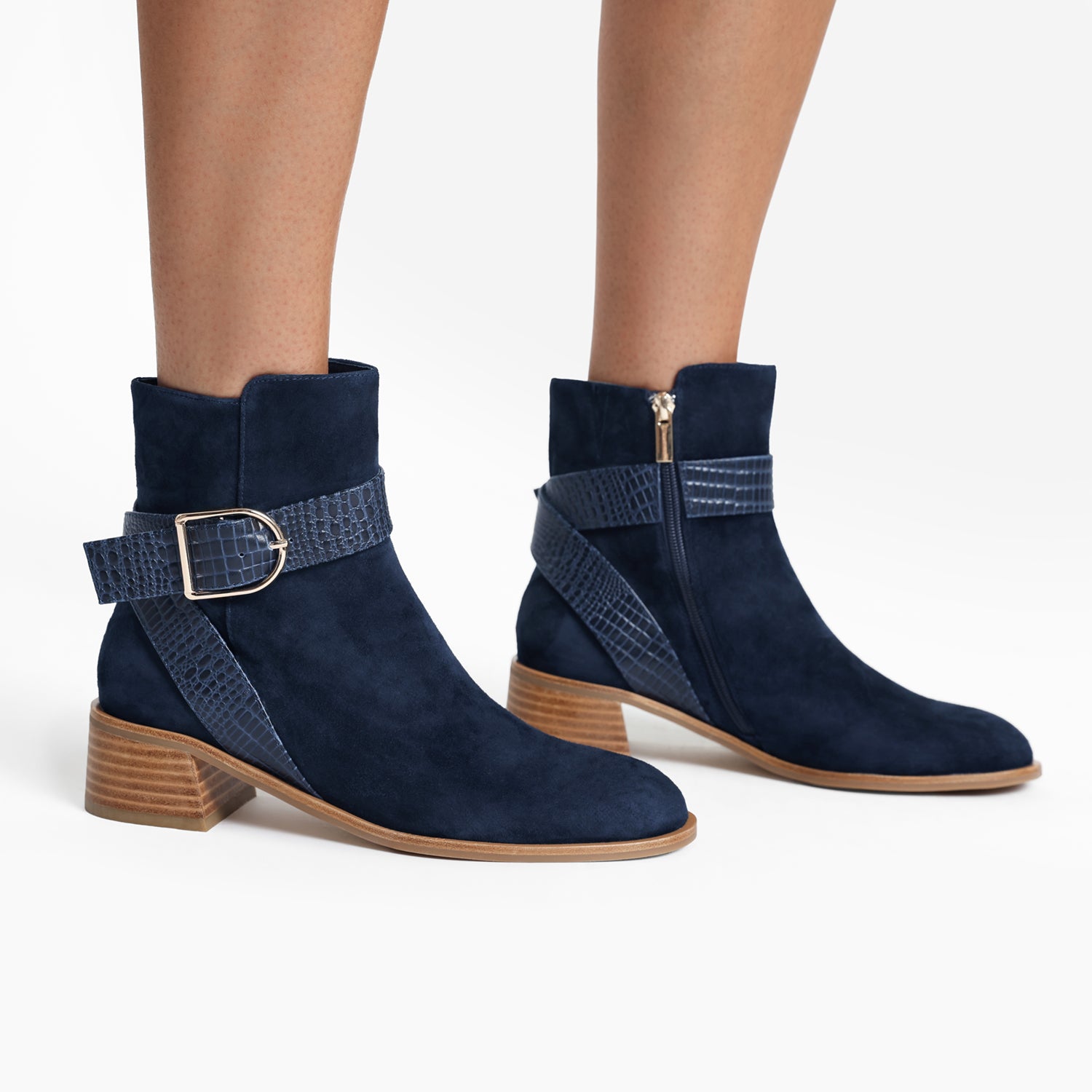 Bologna navy suede ankle boot on women's feet.