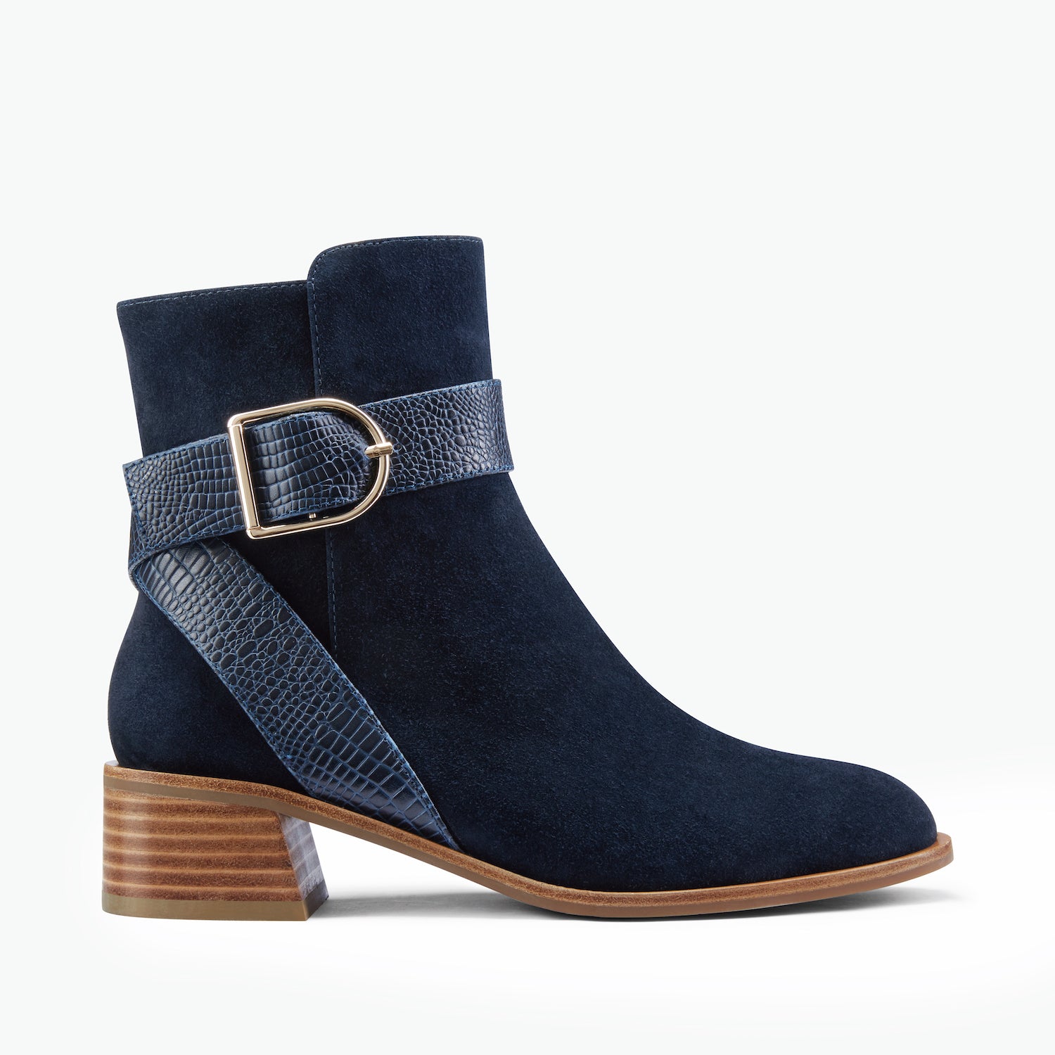 Bologna navy suede ankle boot with strap detail and gold buckle shown from the side.