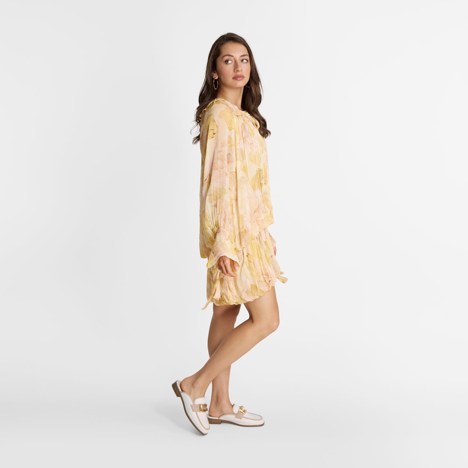 Model wearing Nicole Rebstock mules called Brooklyn. Bestseller with cream upper and nude trims with gold metal hardware.