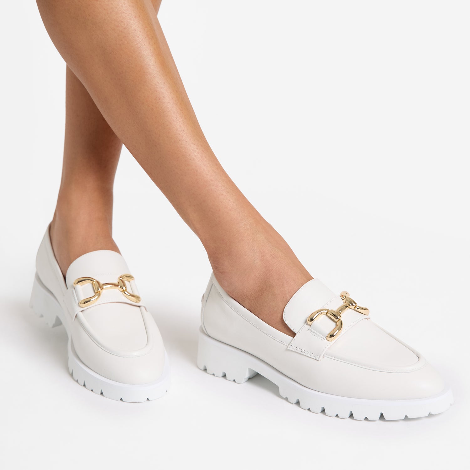 California off-white leather loafer worn by model.