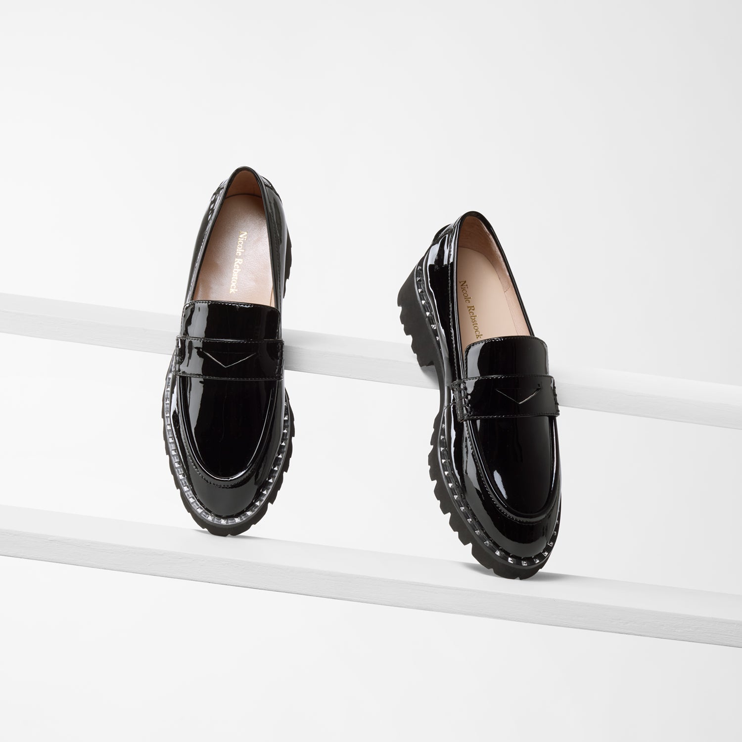 Czech Loafer in black patent with chunky soles and silver studs around the soles.
