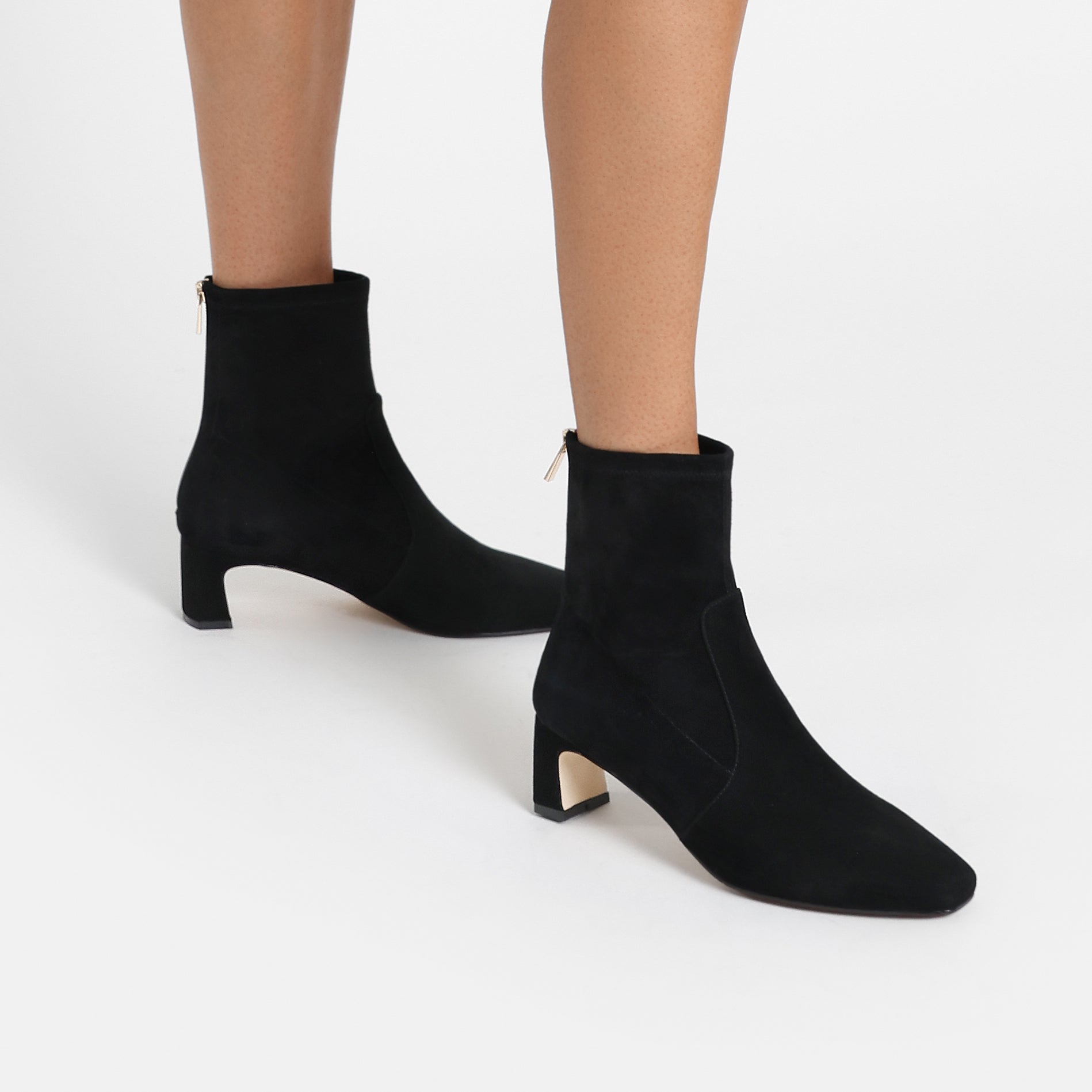 Demi black suede on women's feet.