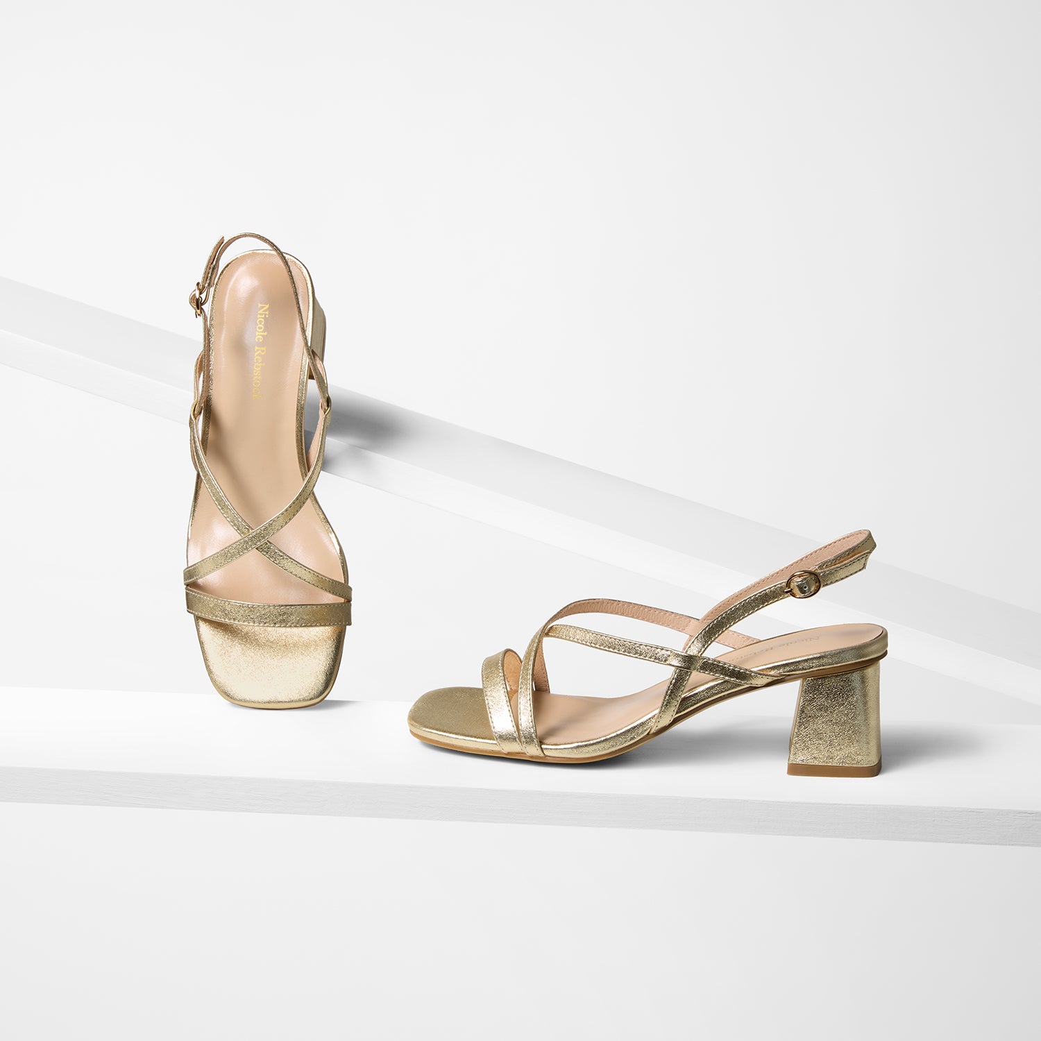 Ella sandal in planks shown in all angles. Gold leather and straps.