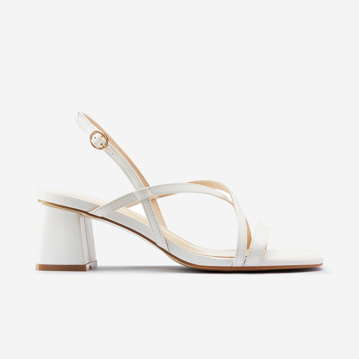 This side shot is showing the Ella Sandal in off-white. They have cross straps and gold buckle with a 6cm heel.