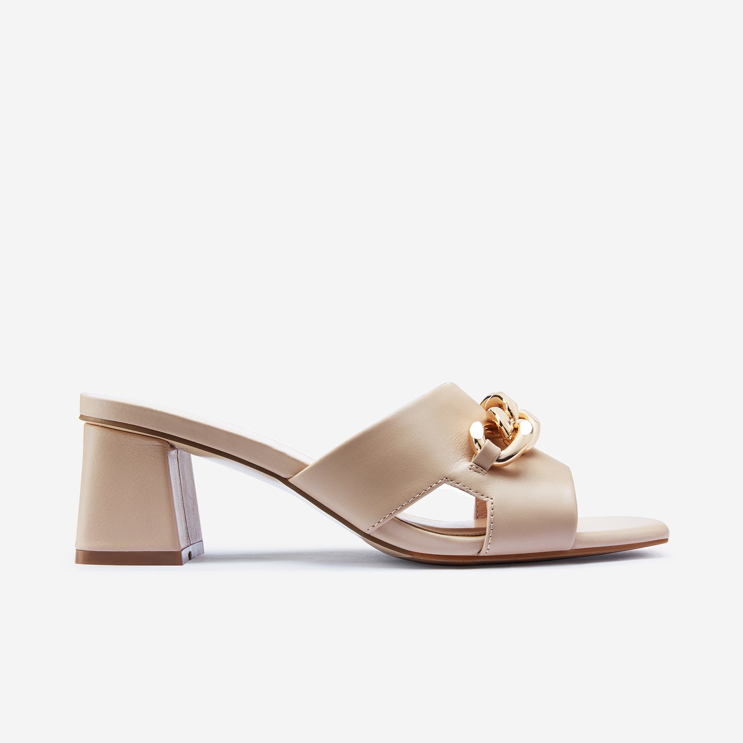 Evie sandal from the side. Nude leather with metal gold chain details.