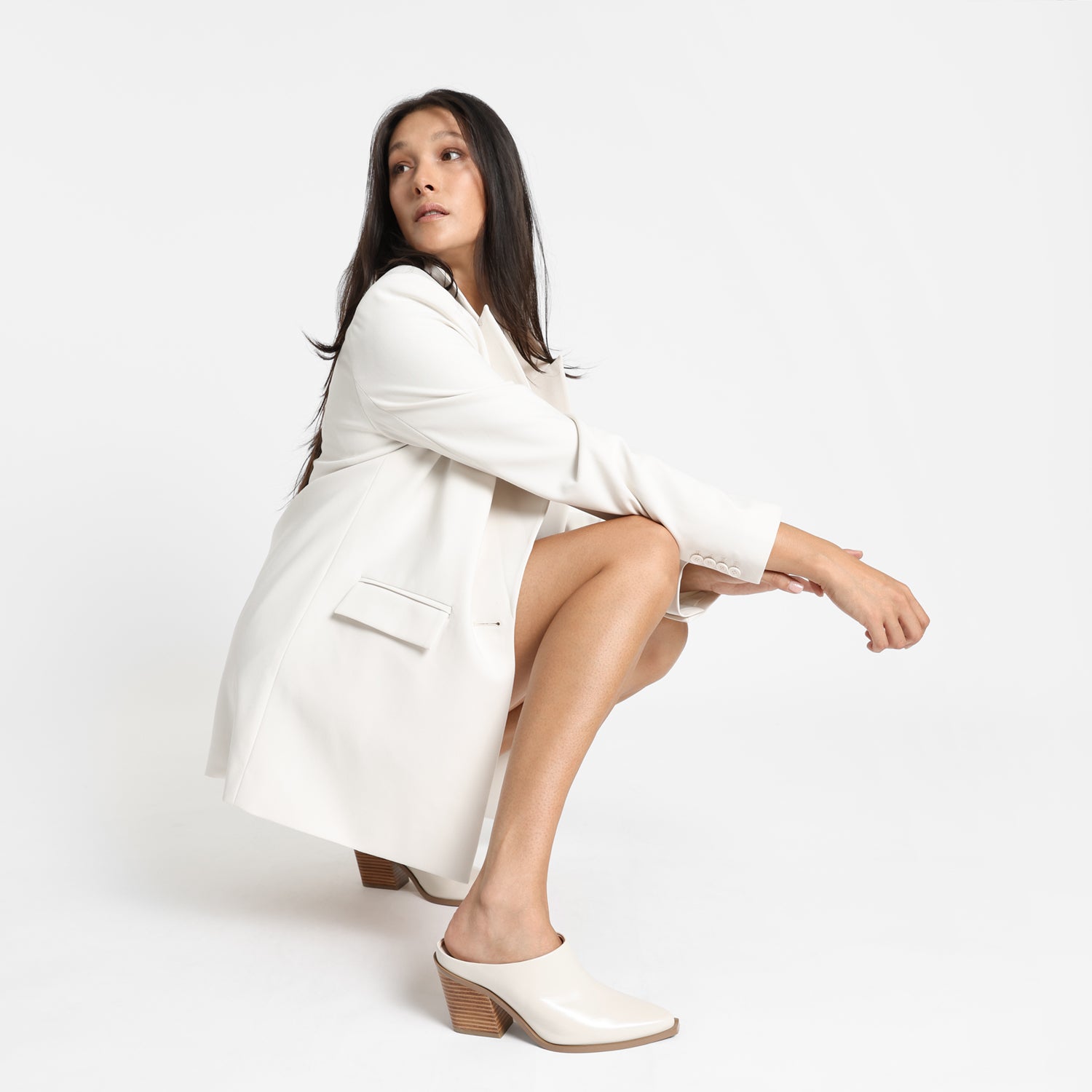 Close up of Fabio ivory mule worn by model.