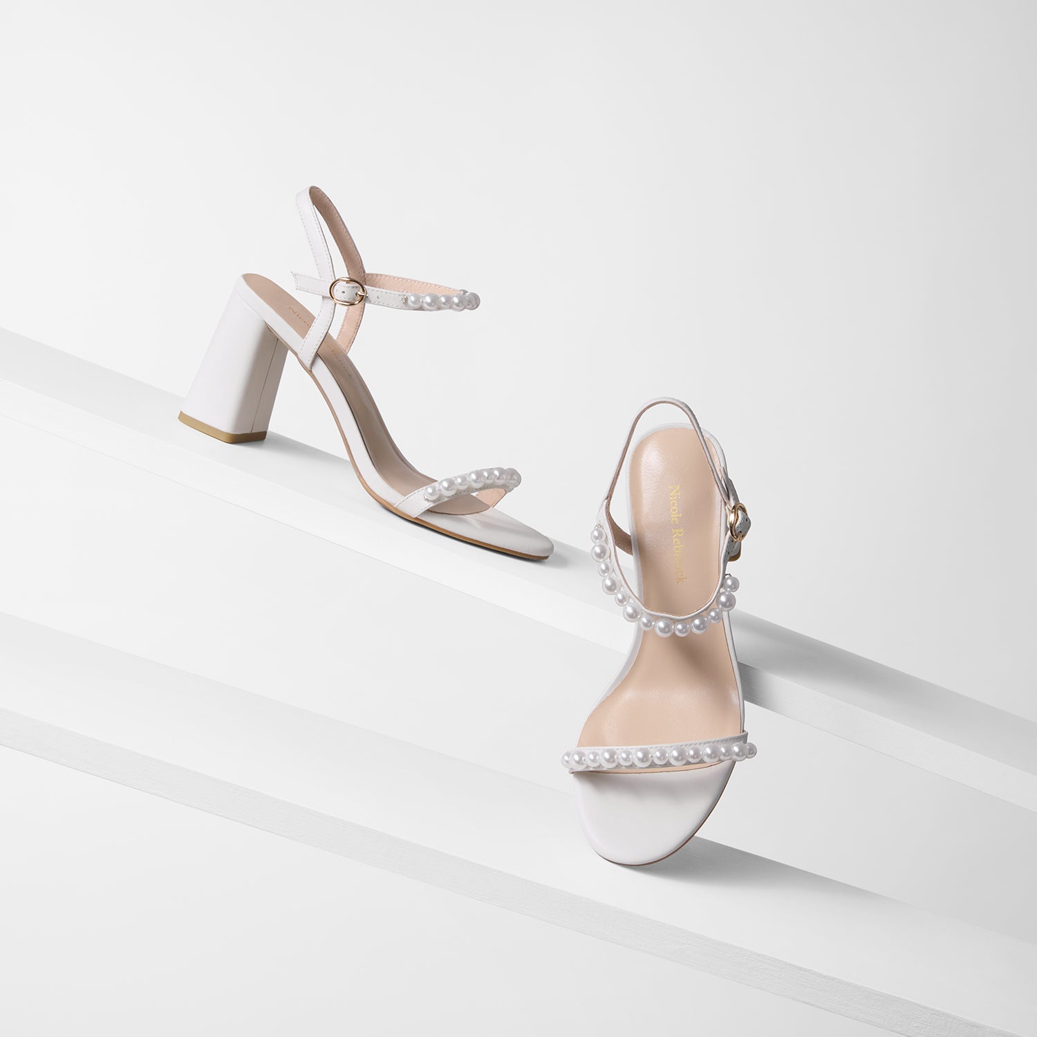Flo off-white sandals on planks shown from all angles.