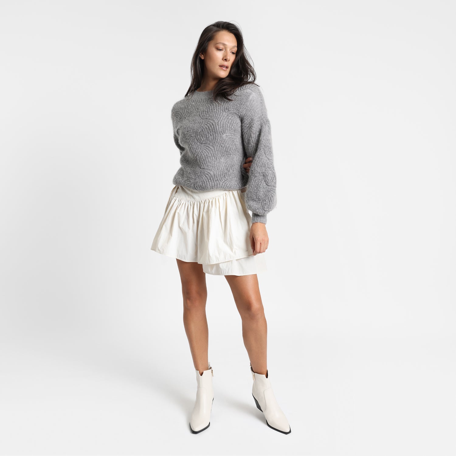 Franklin ivory leather ankle boot on model showing pointed toe.