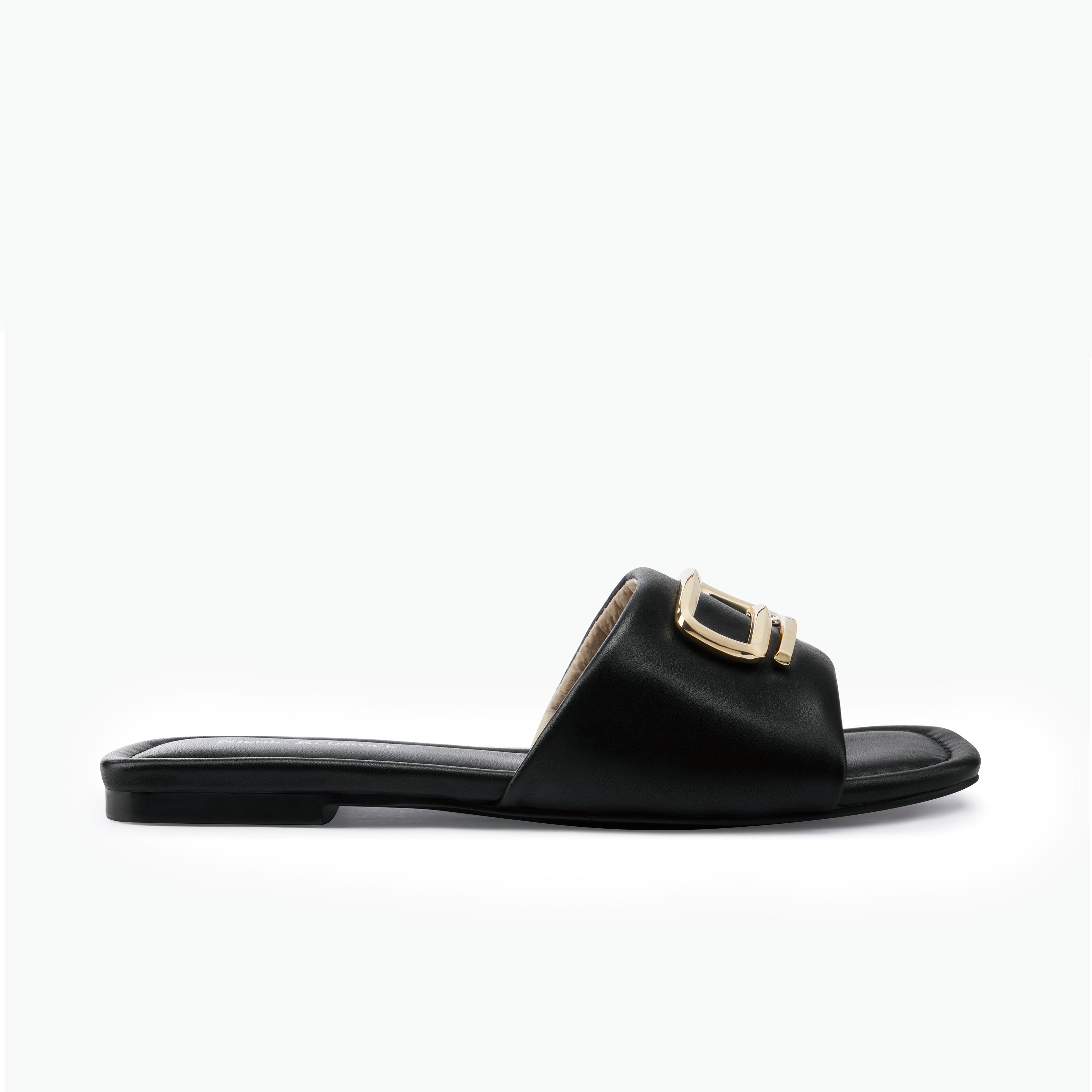 Black sandal with a gold buckle on a white background