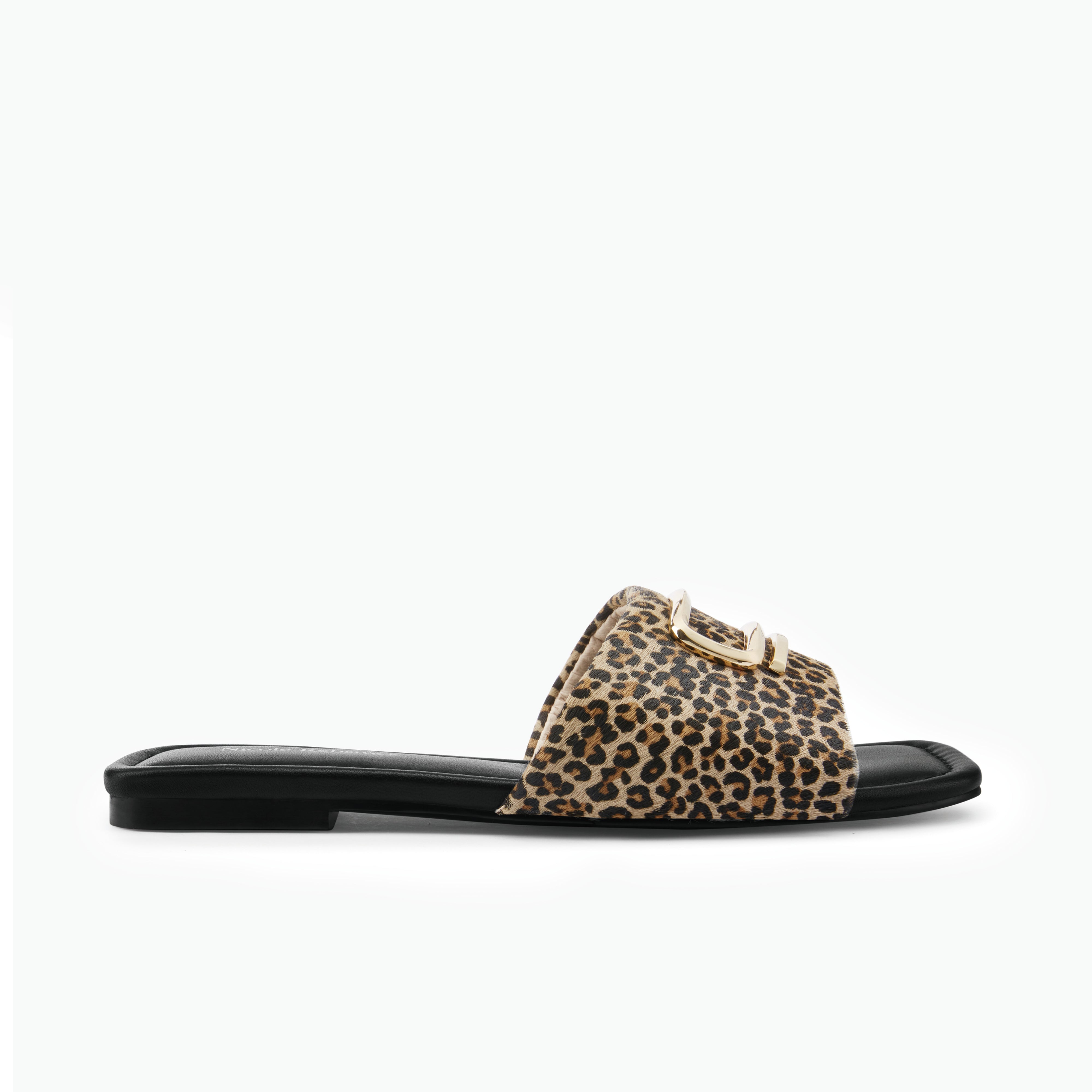 Leopard print slide sandal on a white background by Nicole Rebstock