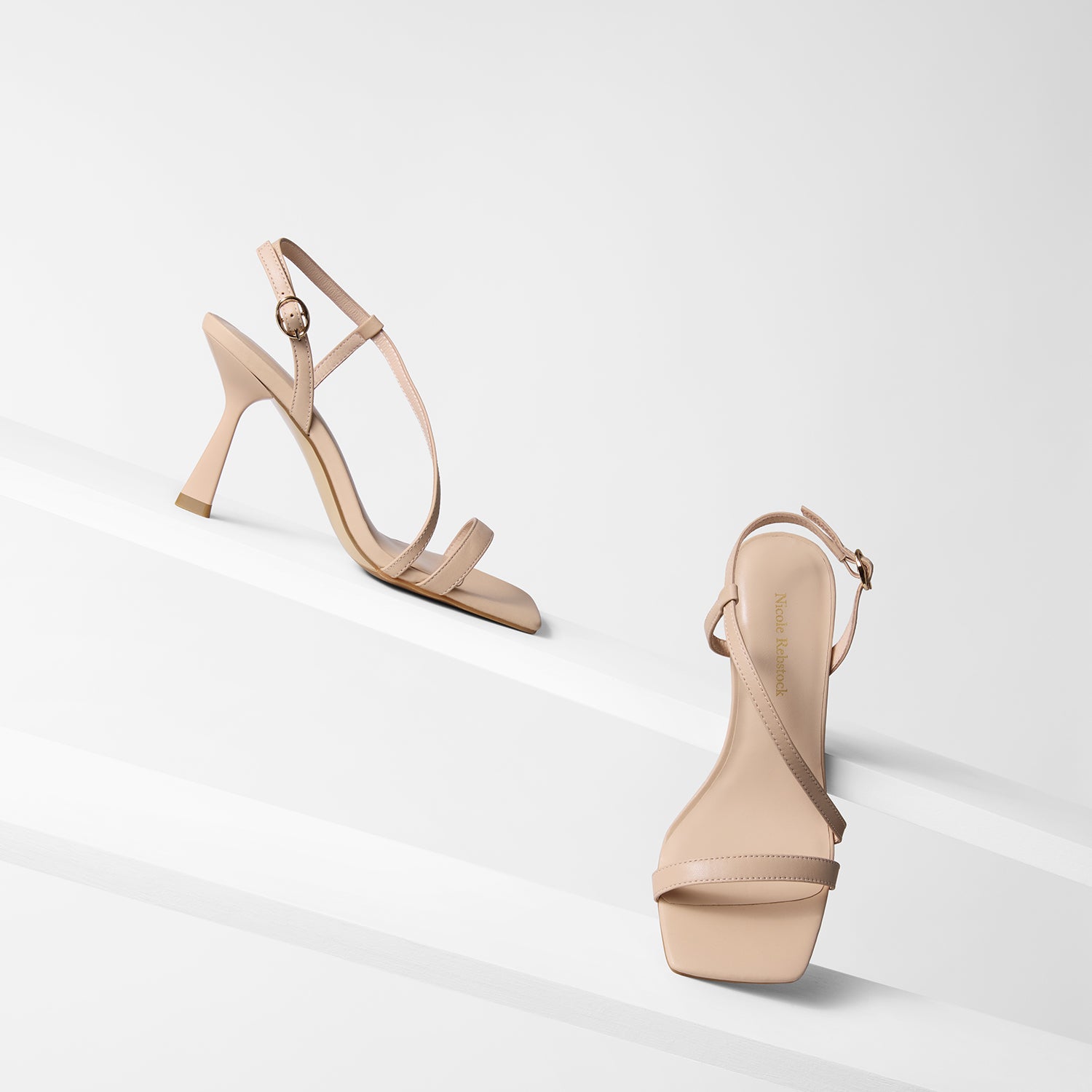 Gabby Sandals in nude shown from all sides. They have a powder coated heel and gold buckles.