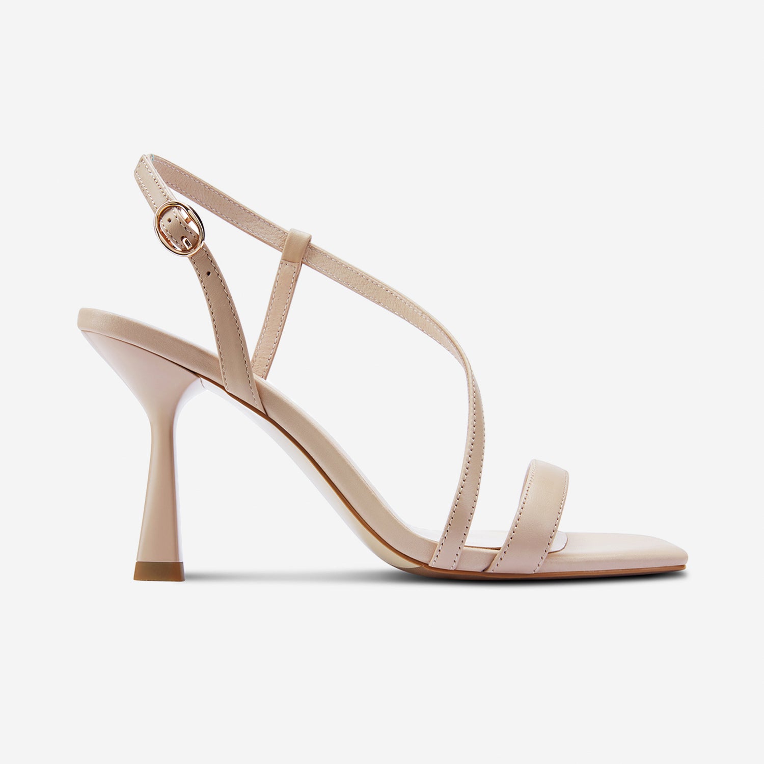 Side profile of the Gabby sandal in Nude. 8.5cm heel with square toe.