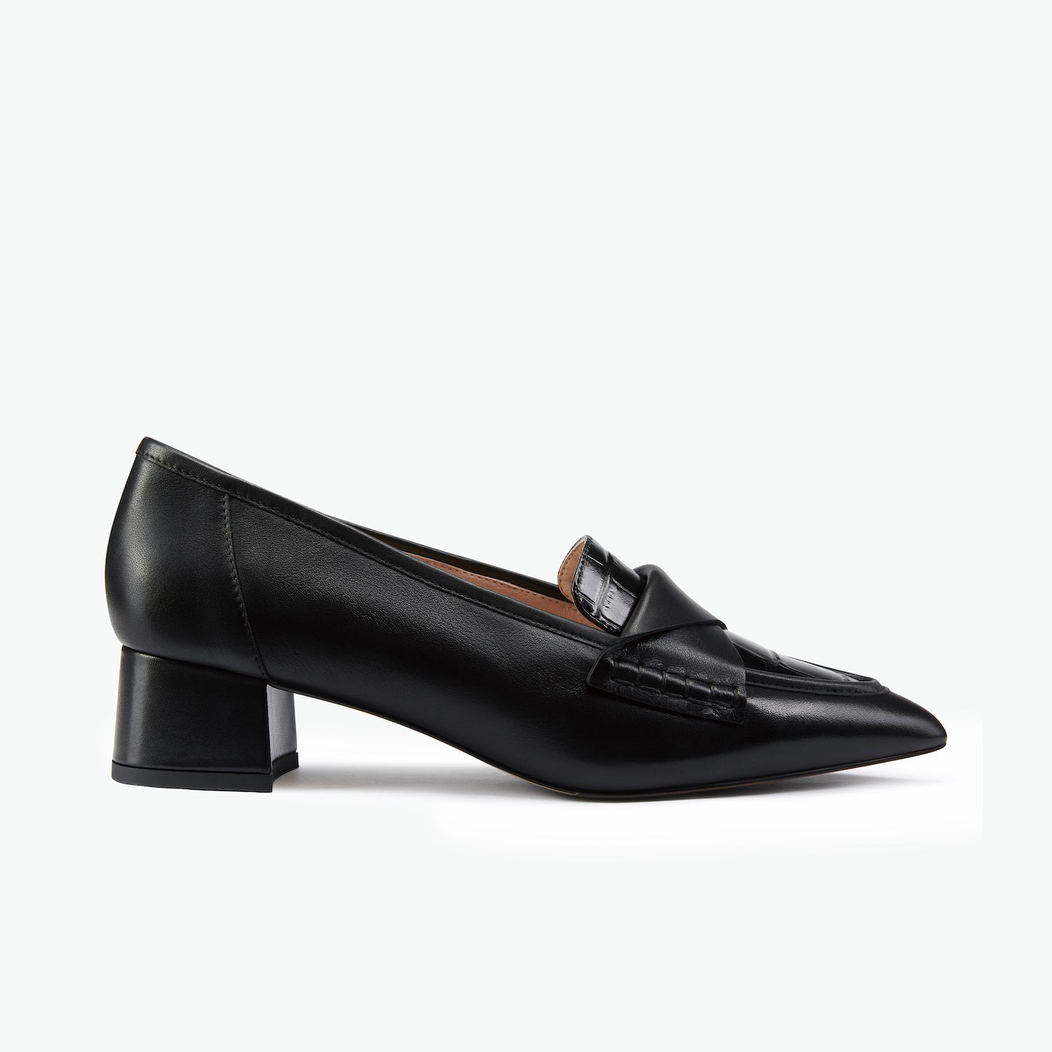 A single black leather loafer-style pump with a pointed toe and low block heel, shown in side profile against a clean white background.
