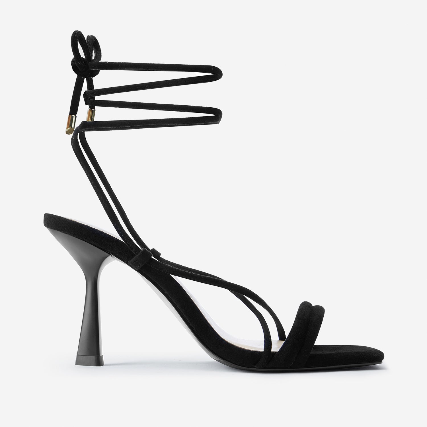 Gio black suede lace up sandals shown from the side.