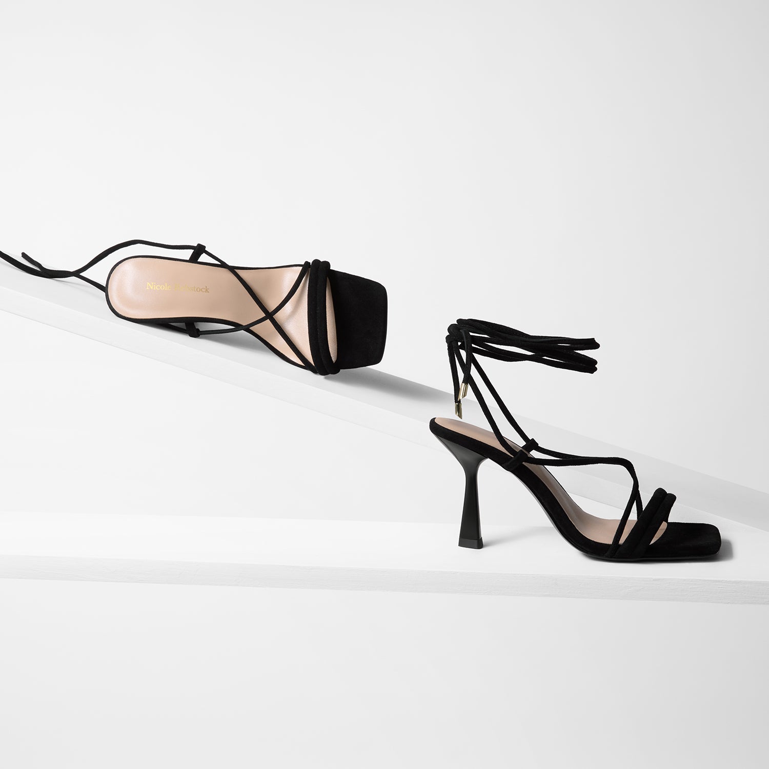 Gio black suede sandals with a 85mm heel and a square toe shown from all sides.