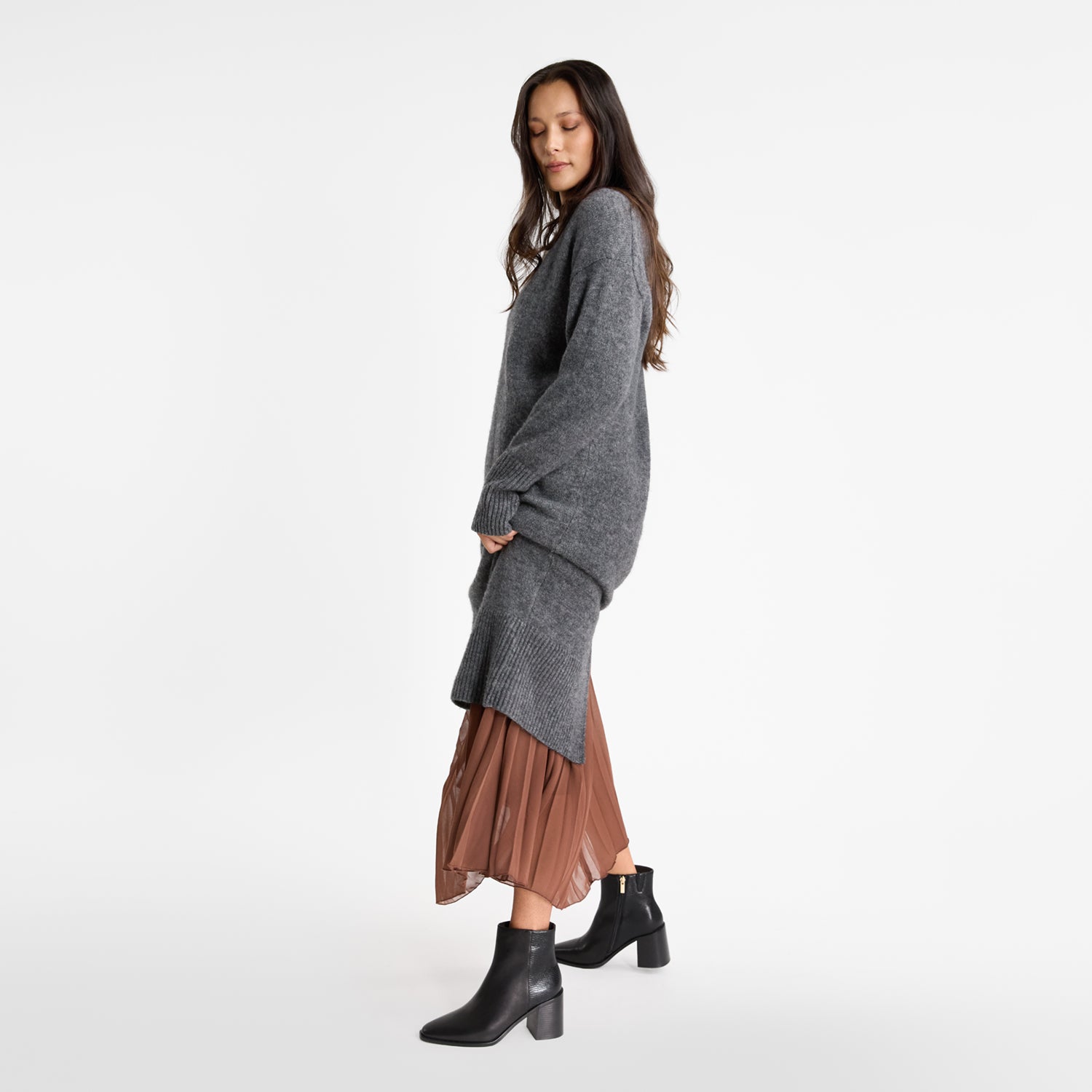 Model wears Nicole Restocks black leather ankle boots called Hali Black Ankle Boot.