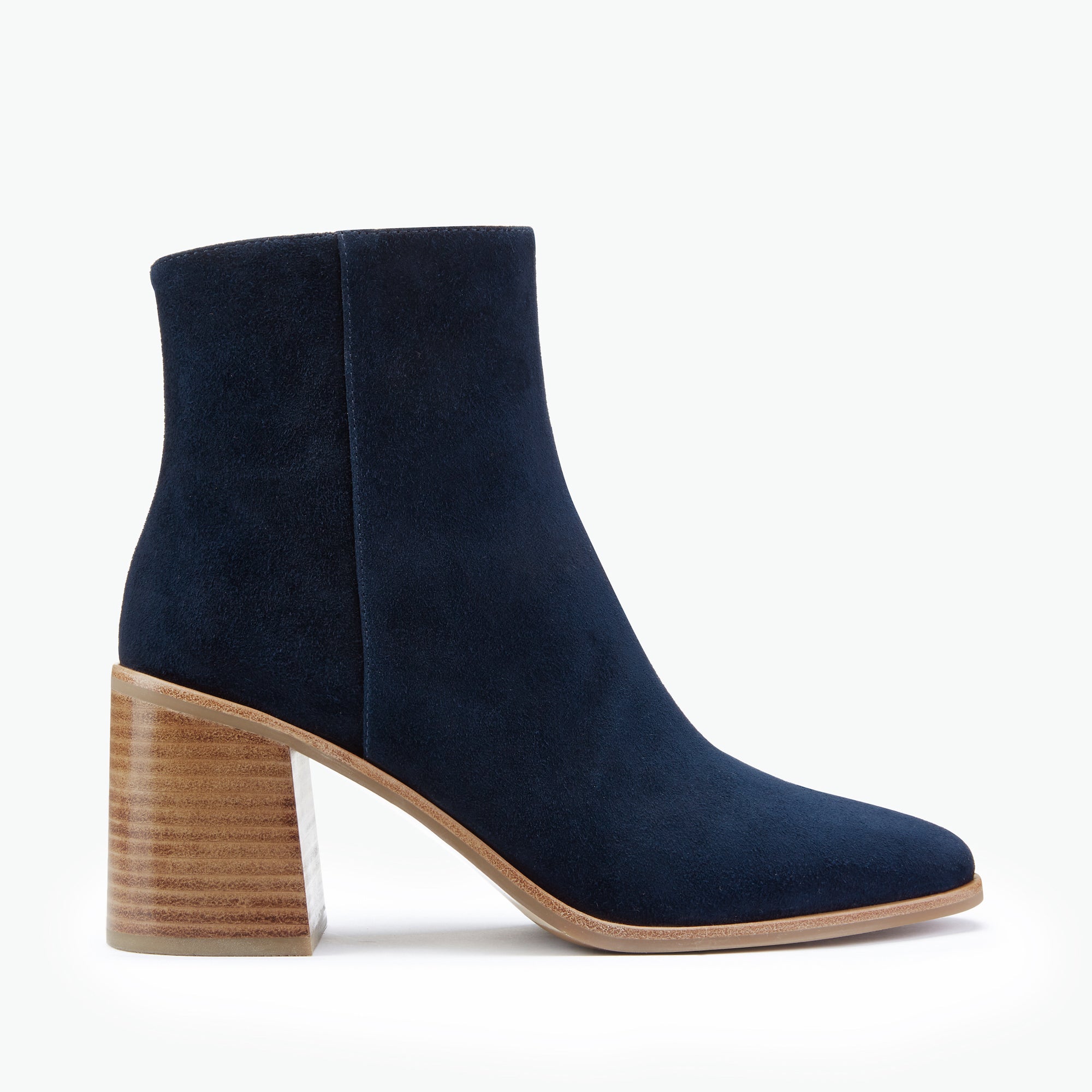 Navy blue ankle boot with a wooden heel on a white background by Nicole Rebstock. 8cm Block heel and almond toe.