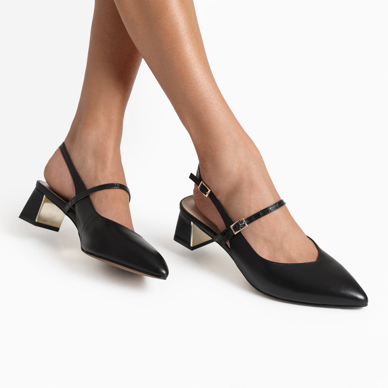 Close up of Harper Slingback in black leather, worn by woman.