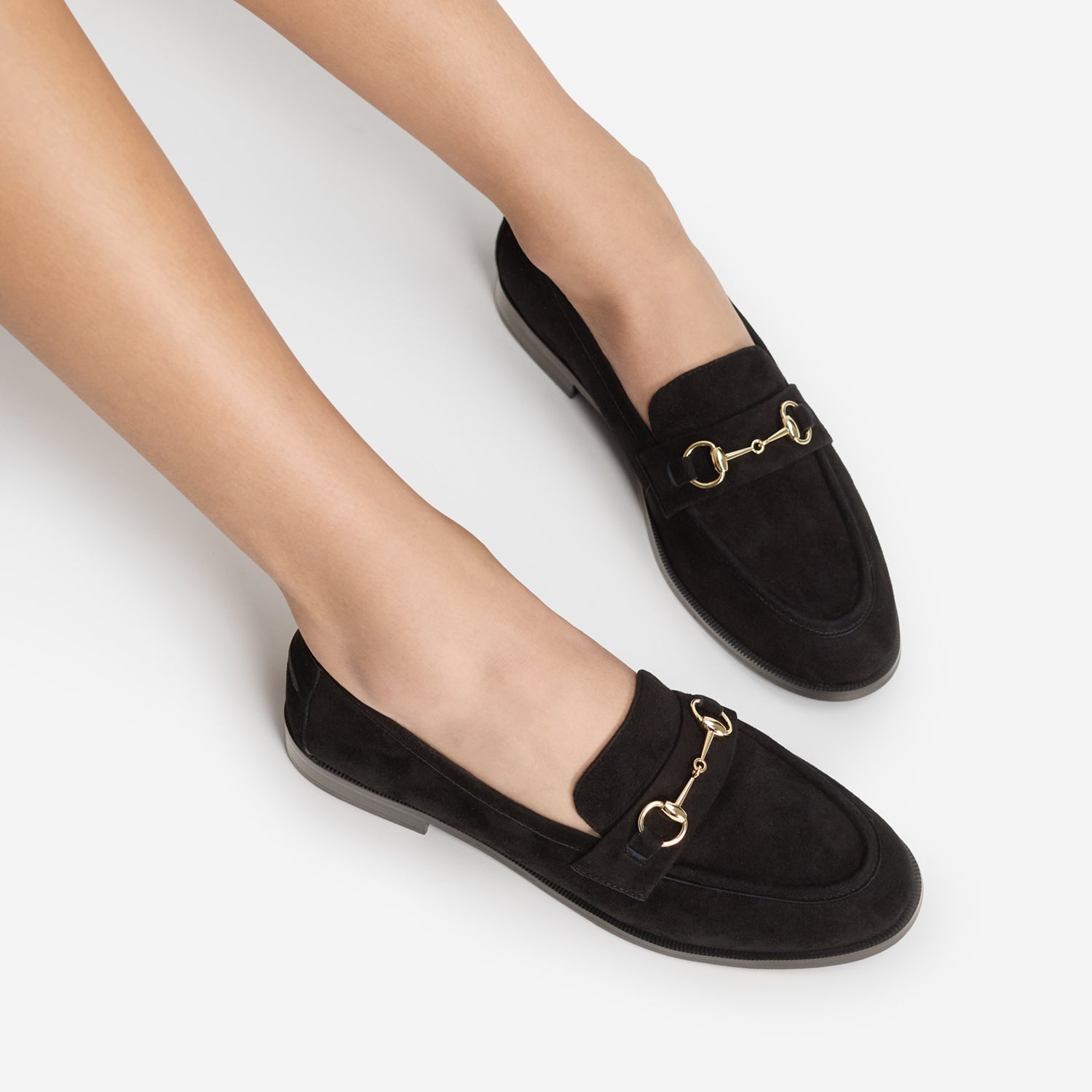 Almond round toe loafers by Nicole Rebstock worn by a model.