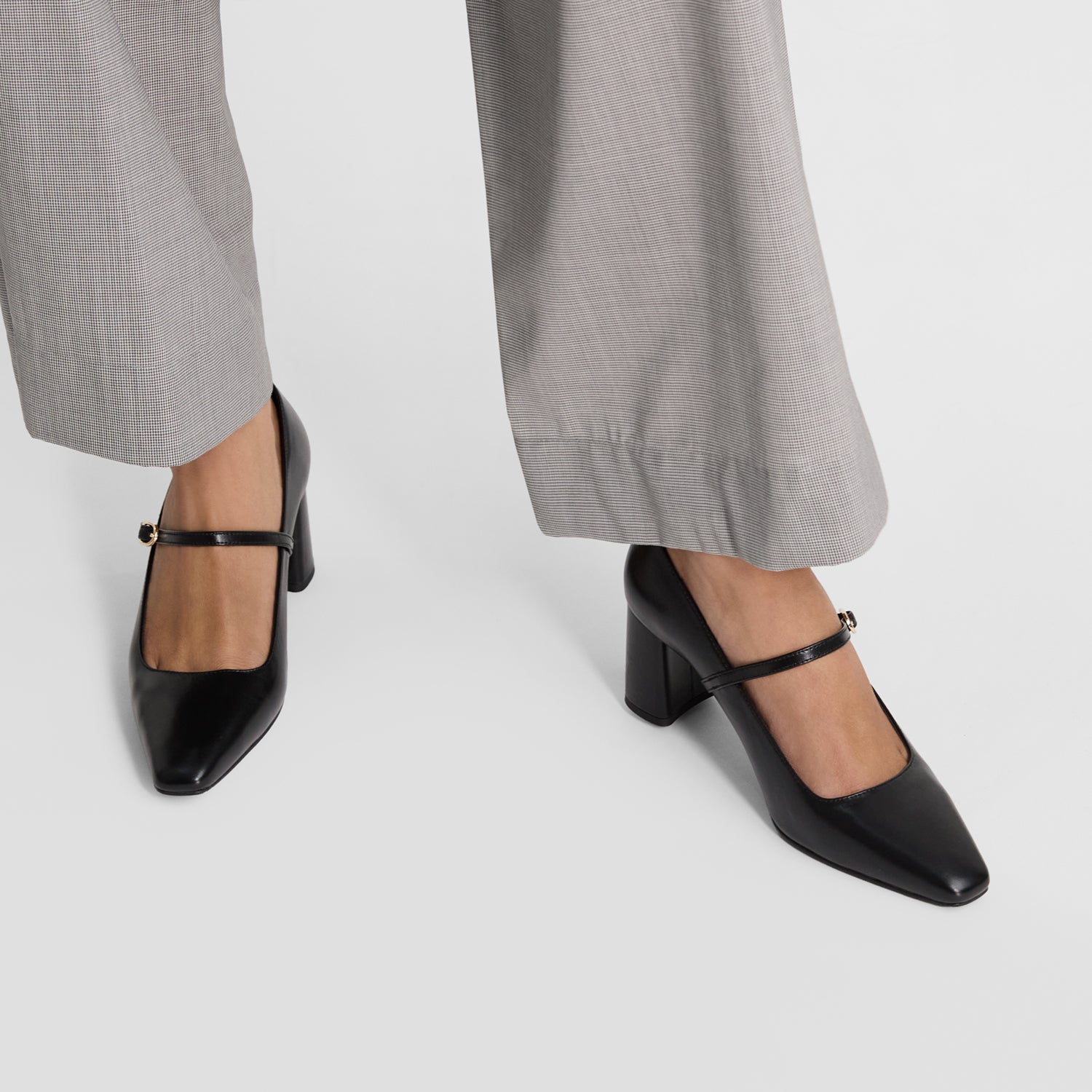 close up view of Nicole Rebstock's black Ivy heels.