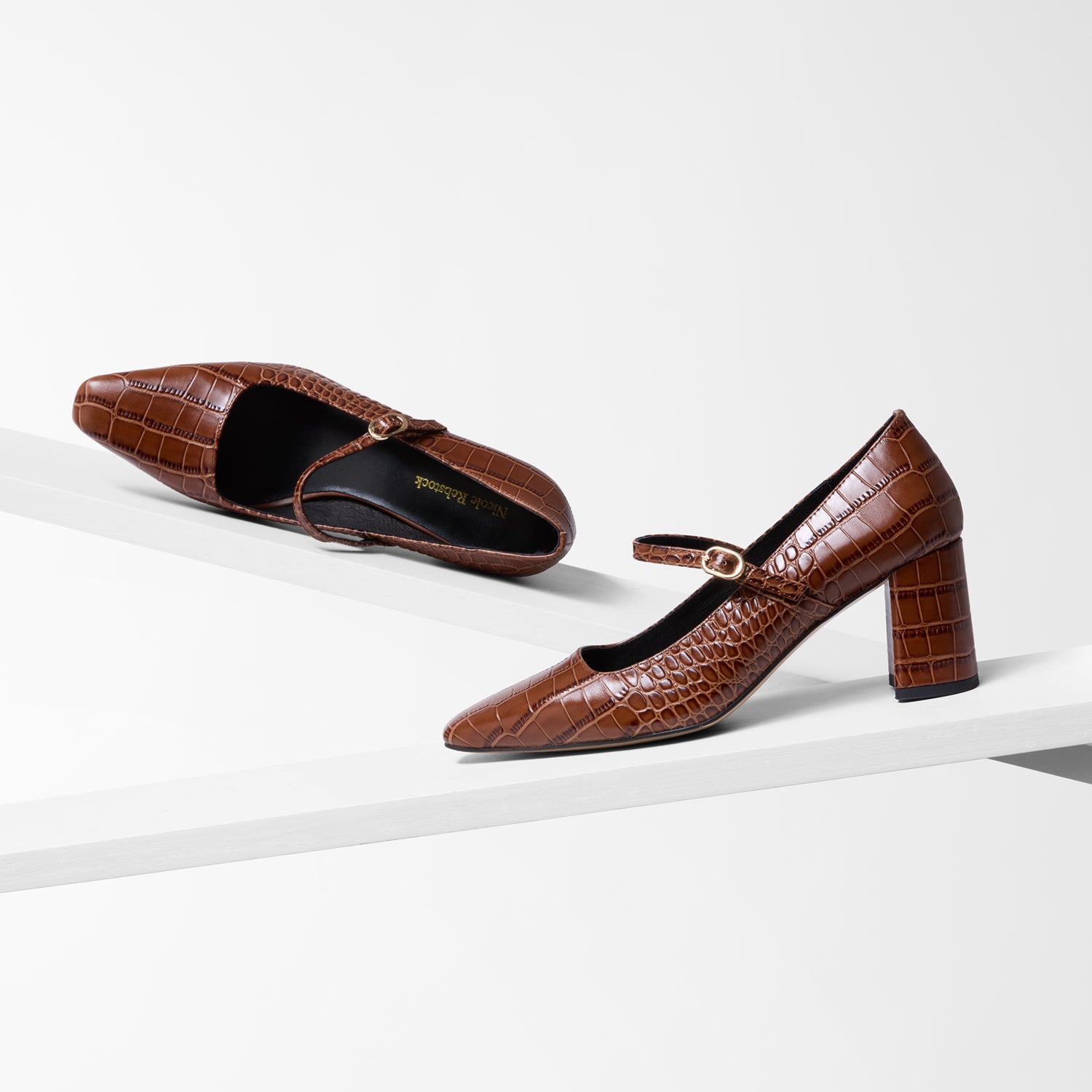 Brown croc print square toe pump.