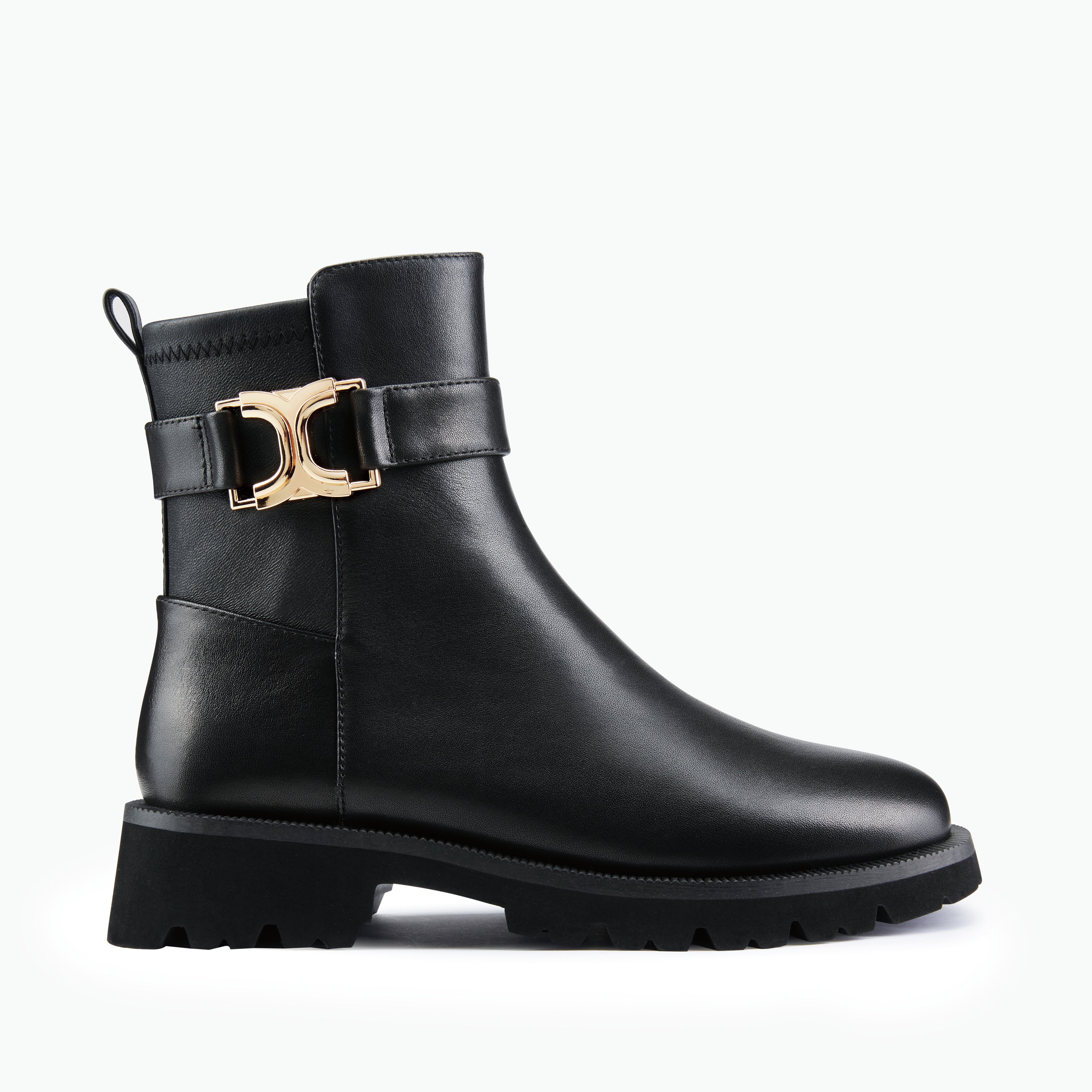 Black ankle boot with a gold buckle on a white background