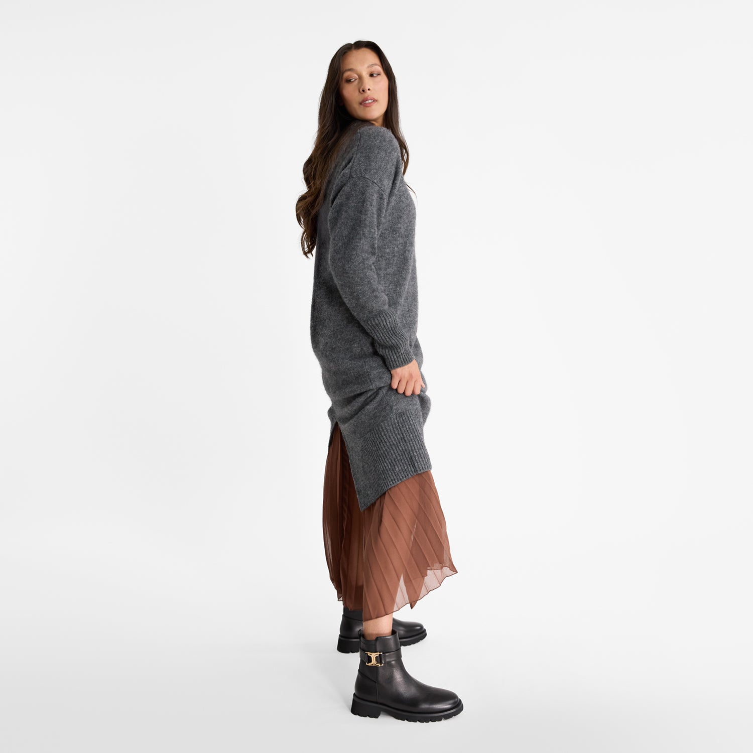 Woman wearing Nicole Rebstock's black Jaso ankle boots with a round toe and thick thread.