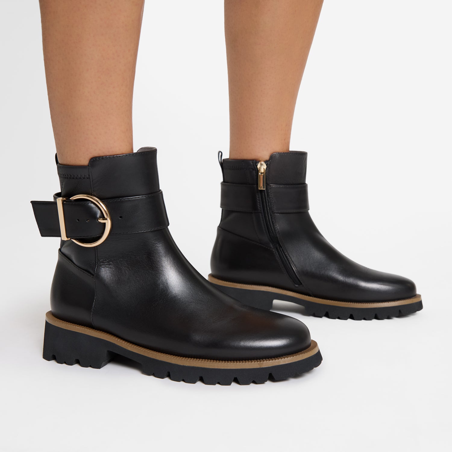 Jaxon black leather ankle boot on women's feet.