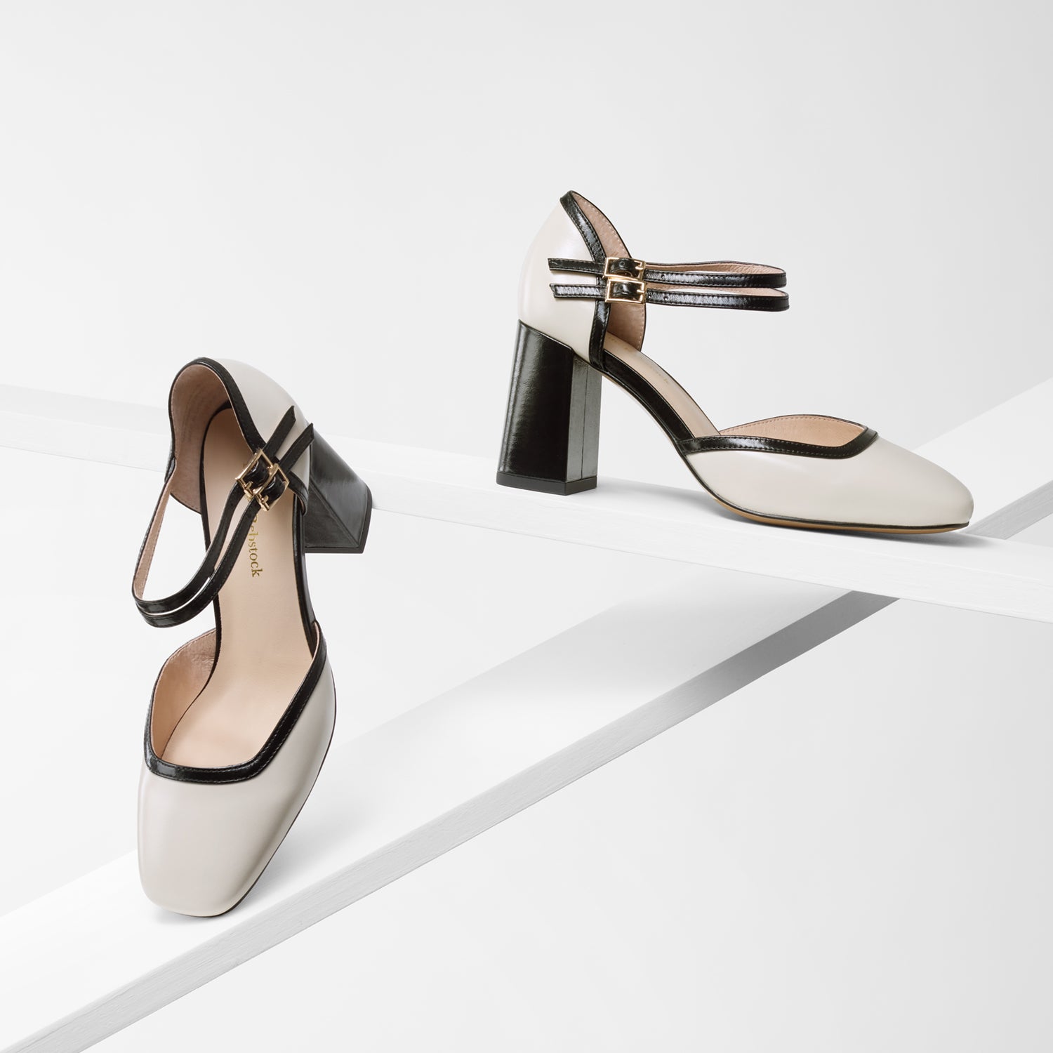 Jelico ivory/black pumps shown from various angles. Medium block heel of 7.5cm.