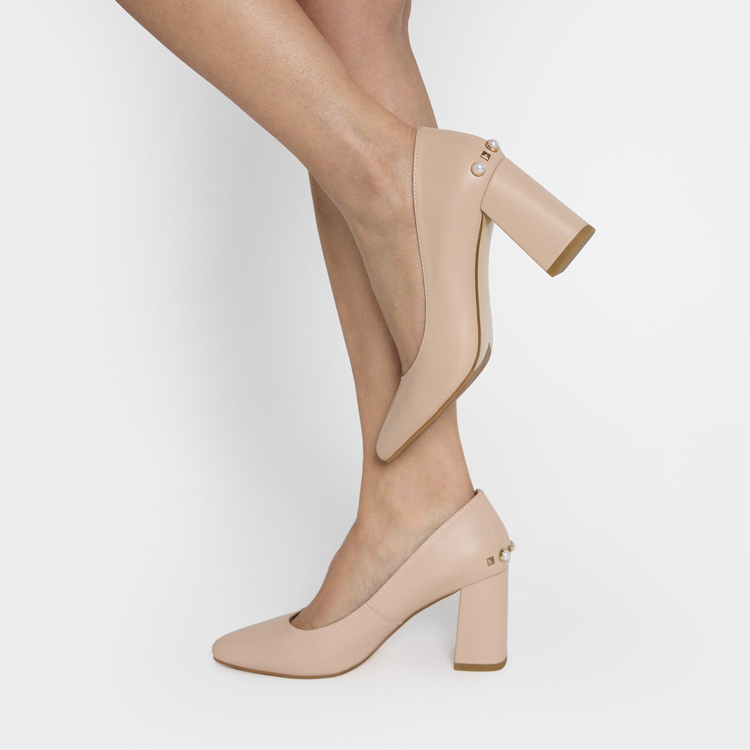 Close up view of Jen heels worn by woman in nude leather. 7.5 cm heel height.