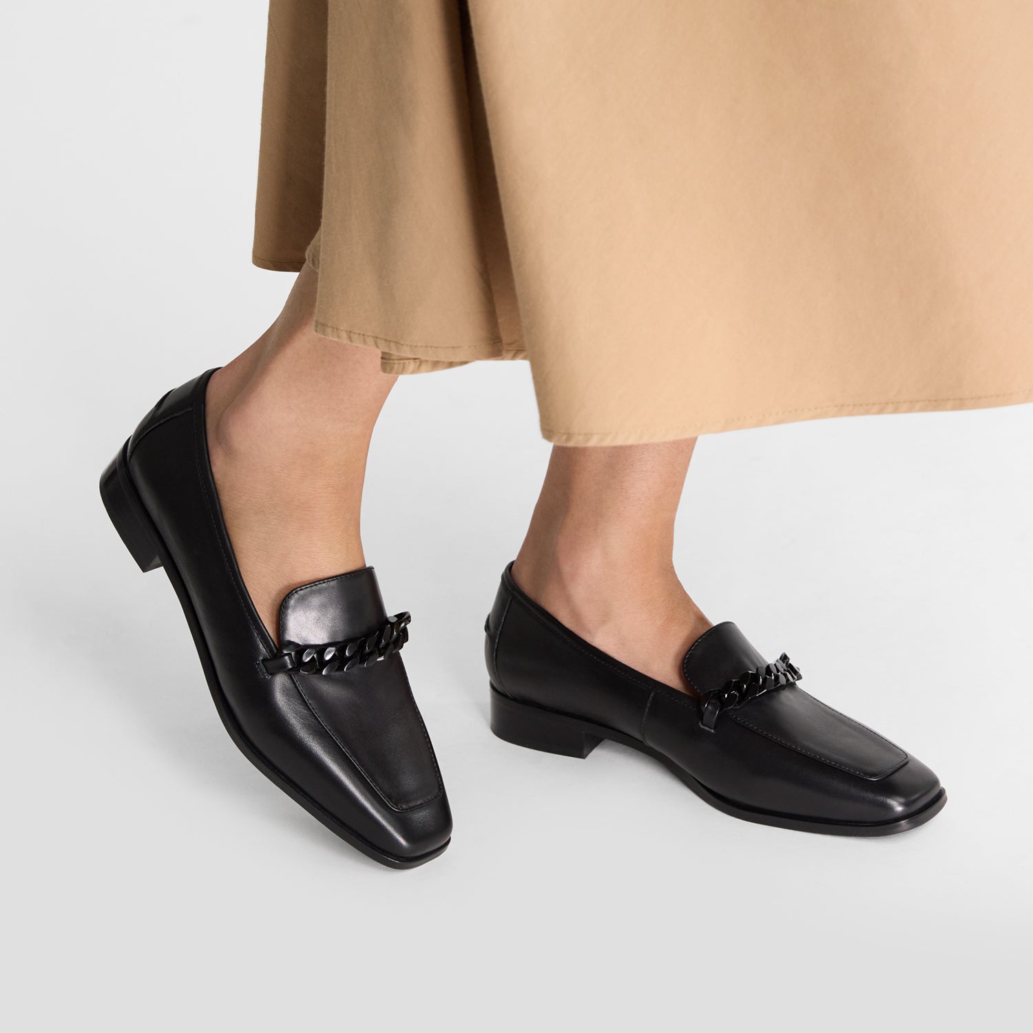 Black loafers with a square toe and 2.5cm heel.