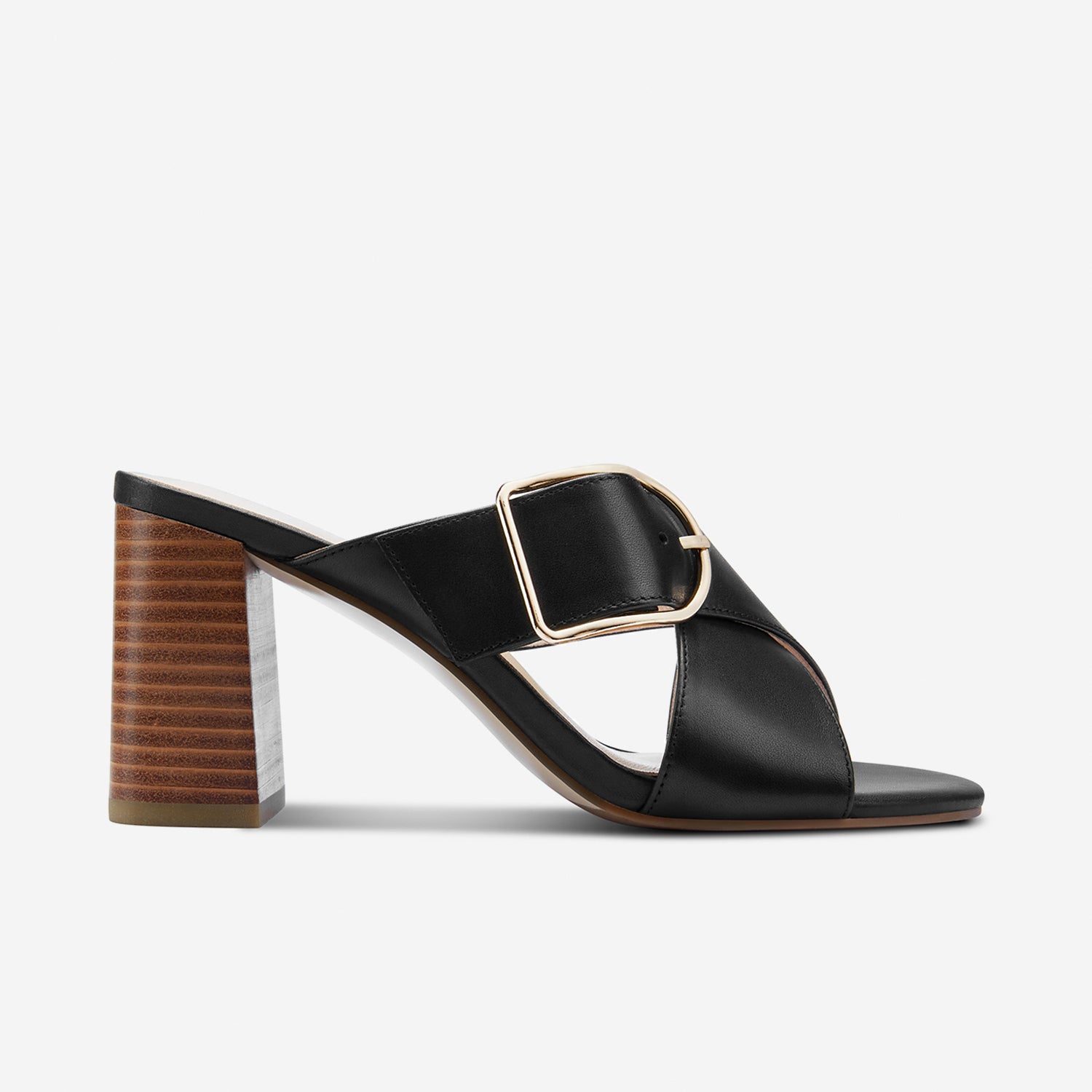 Kylie black leather mule with gold buckle shown from the side.
