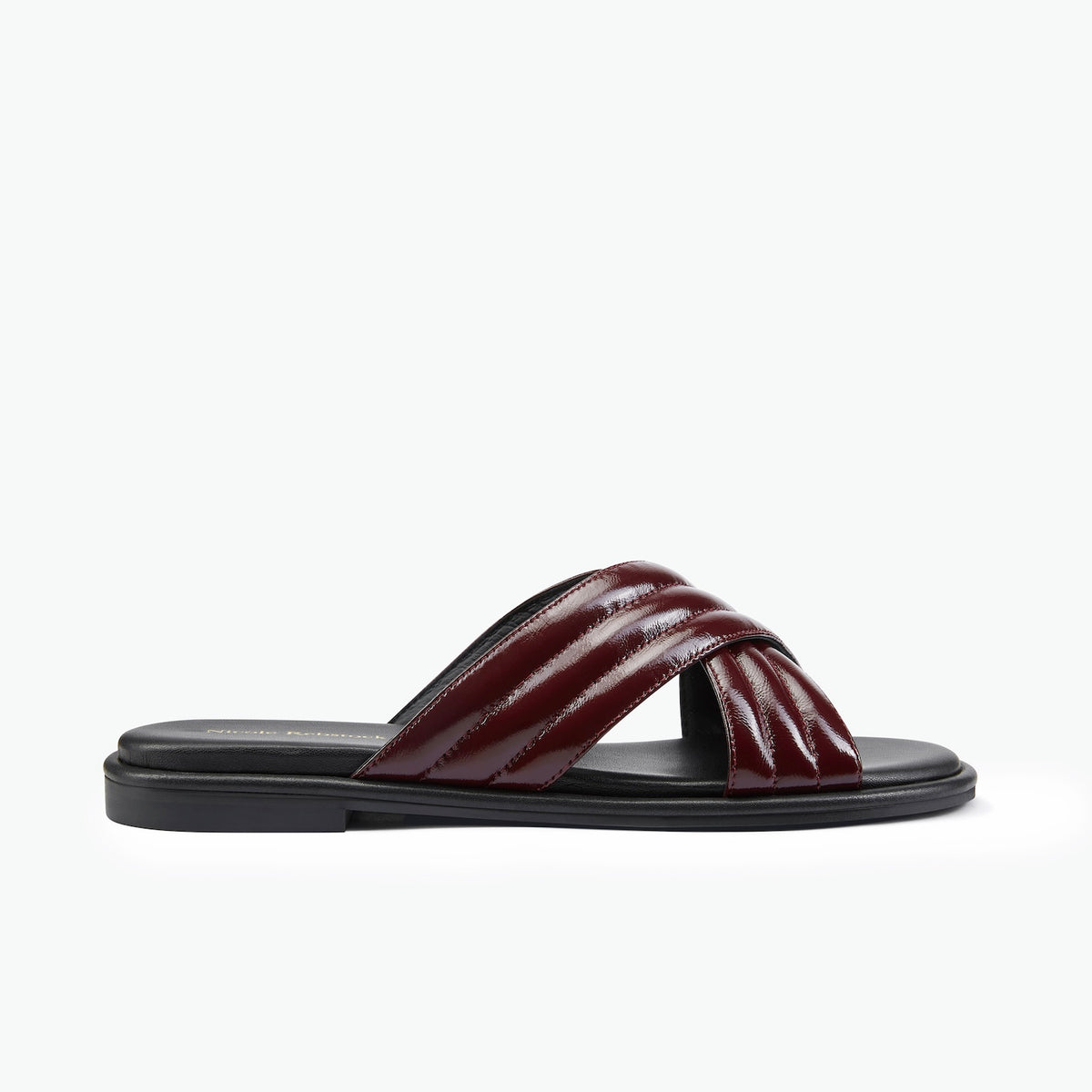 Black sandal with high gloss wine leather straps.