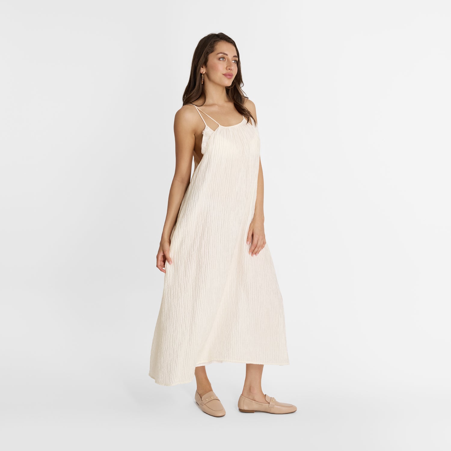 Woman wearing flat nude leather Libby Loafers with 1.5cm heel. By New Zealand designer Nicole Rebstock.