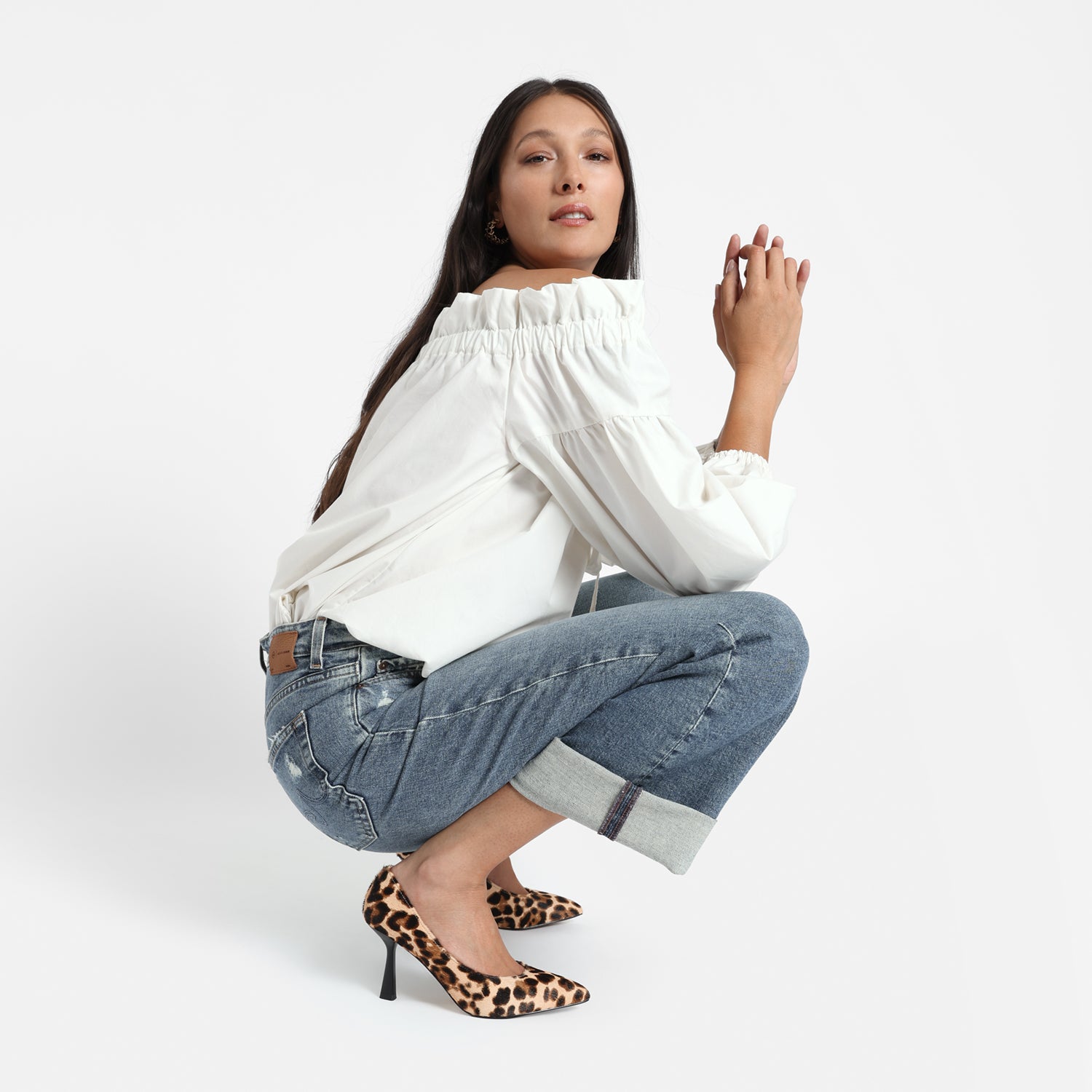 Leopard print calf hair stiletto heels worn by woman called 'Lisbon Pumps'. Heel height is 8.5cm.