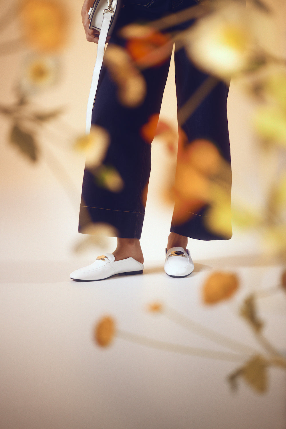 women wearing white loafers called Lola with a 1cm heel.