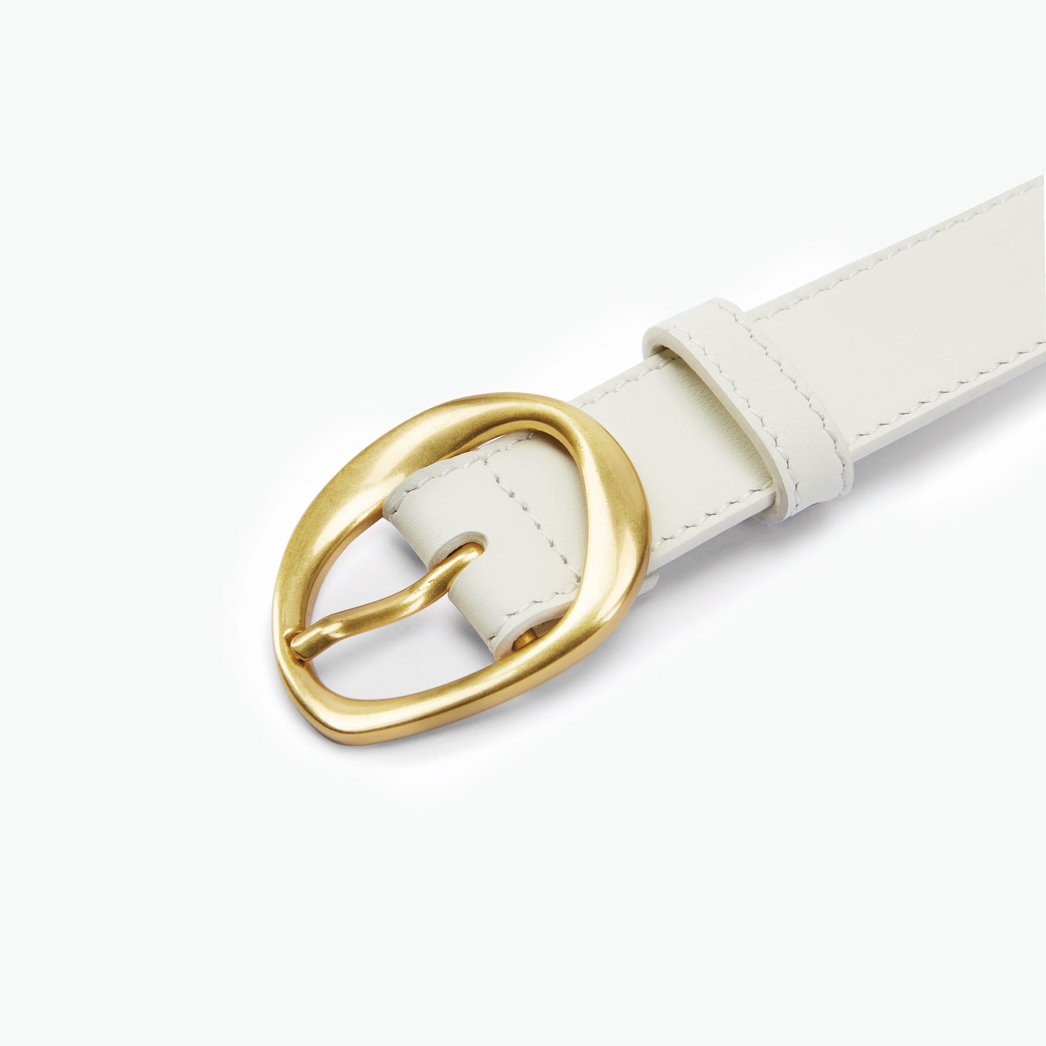 Cream leather belt with a gold molten buckle on a white background