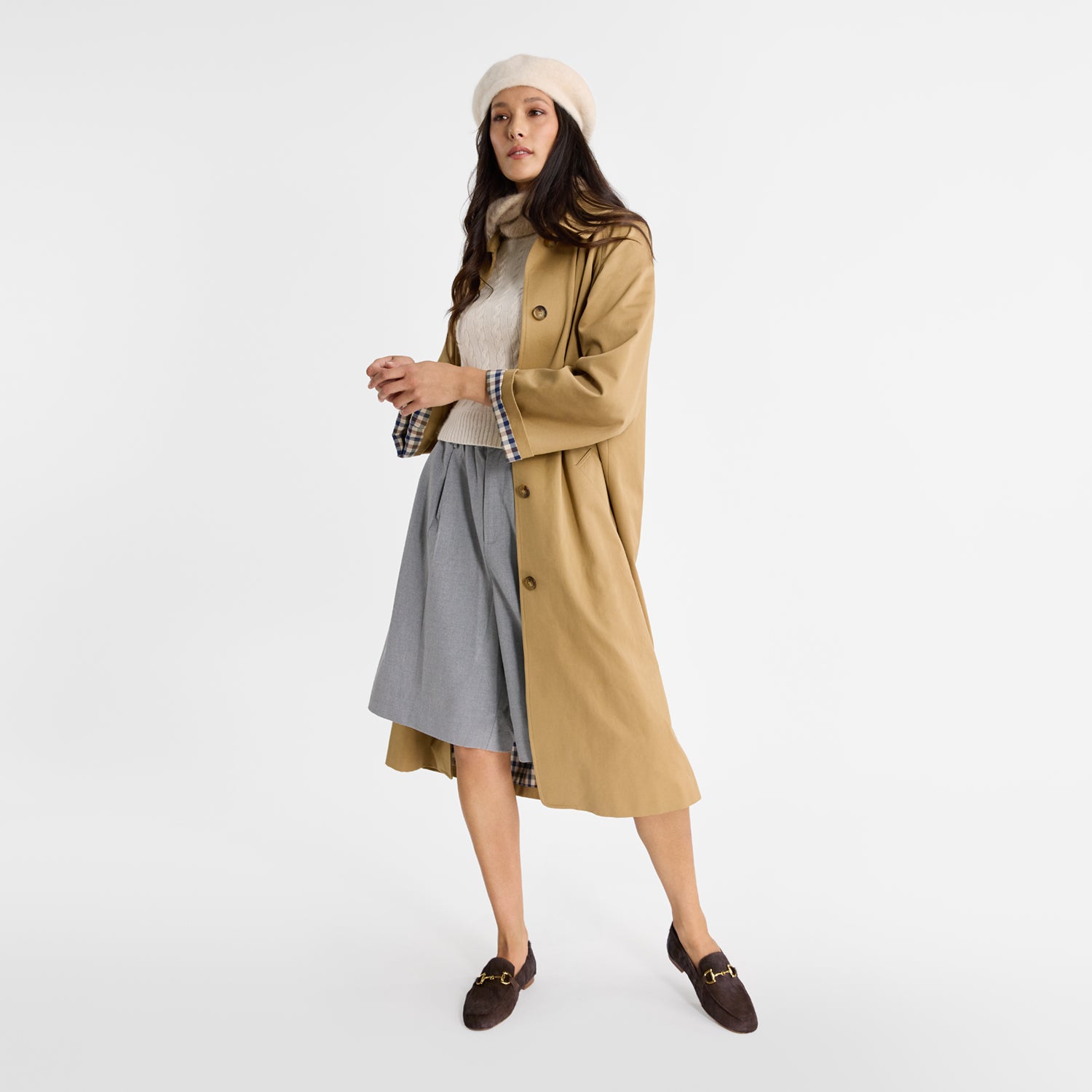 Model wearing Nicole Rebstock brown Mel Loafers with a round toe.