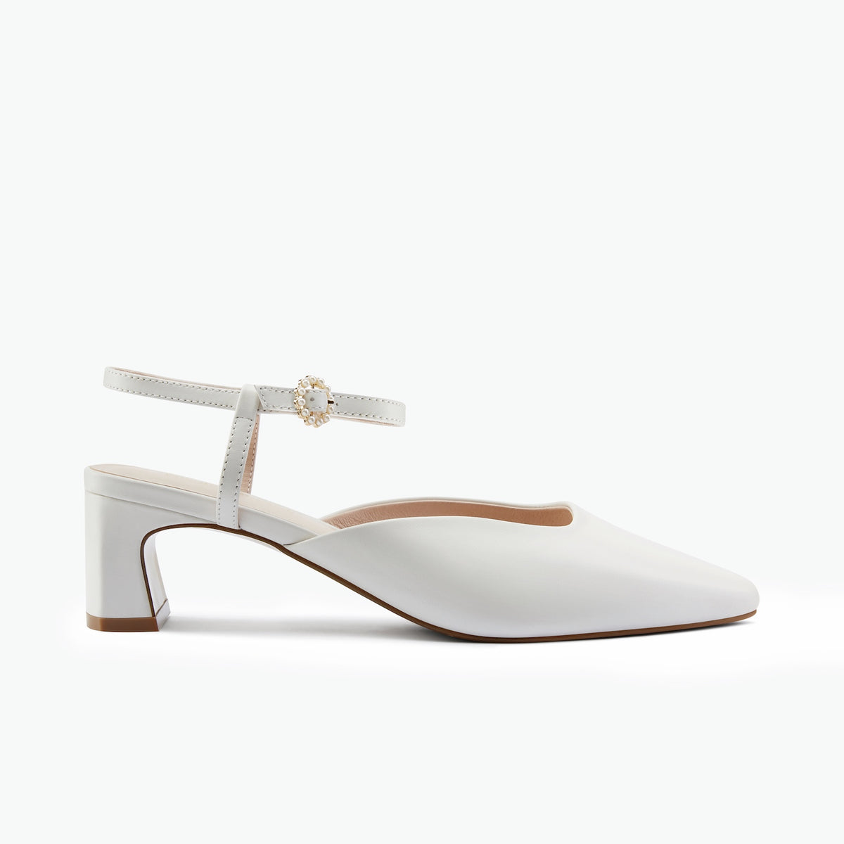 A single white leather slingback sandal with a low block heel, pointed toe, and a decorative pearl-embellished buckle on the ankle strap, shown against a plain white background.