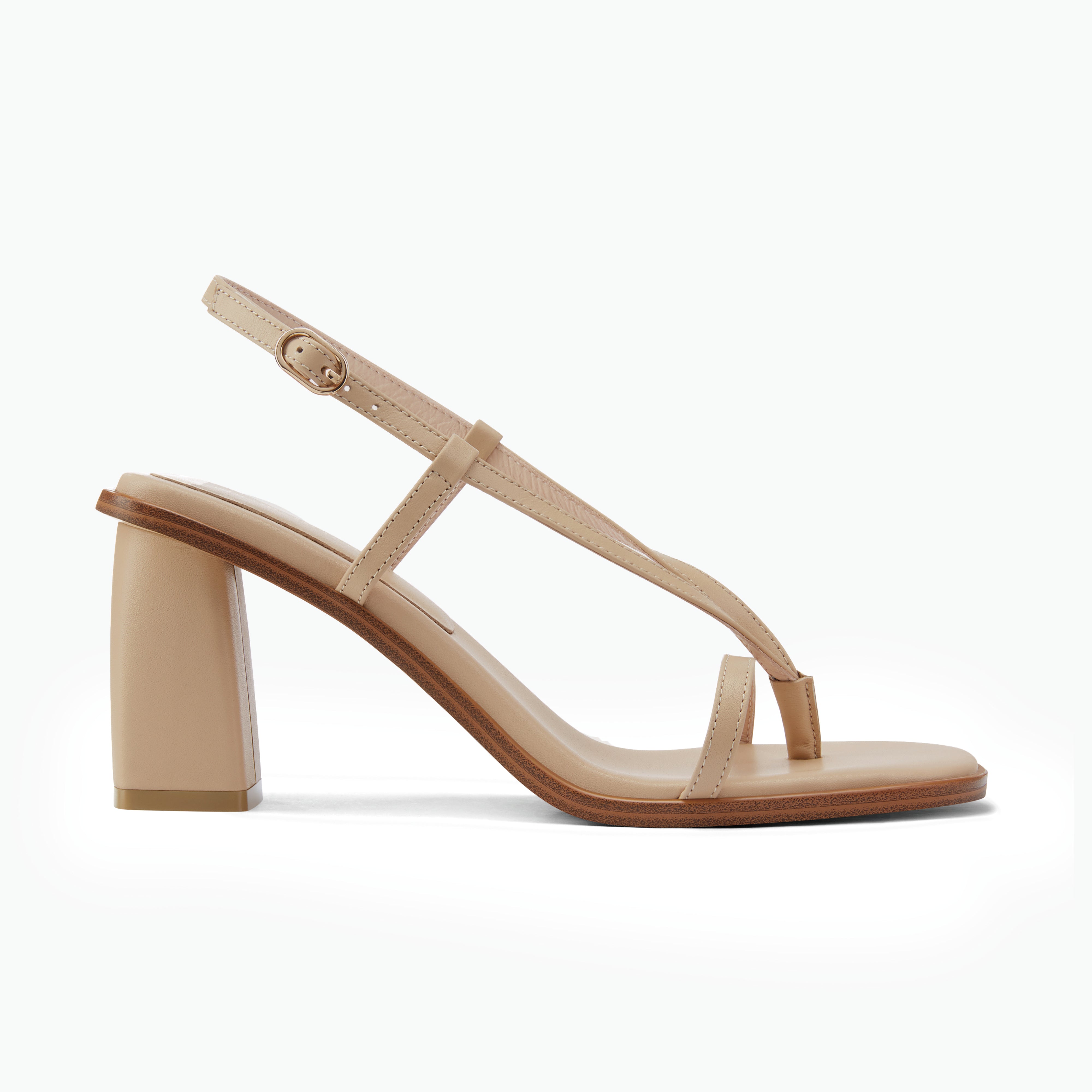 Side profile of nude sandal with block heel and thong toe strap. 7.5cm heel.