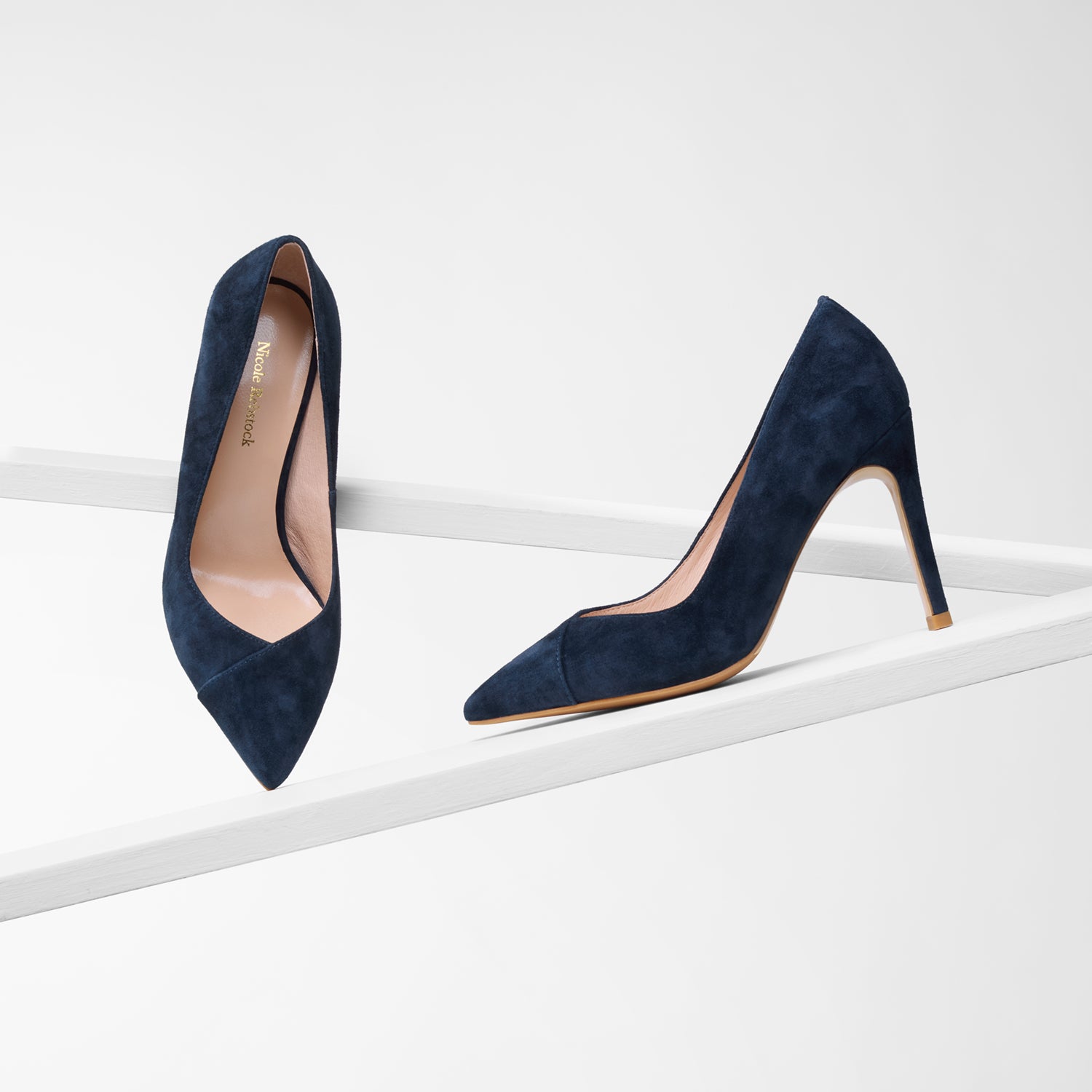 Naples navy suede pump with 95mm heel on planks showing all angles.