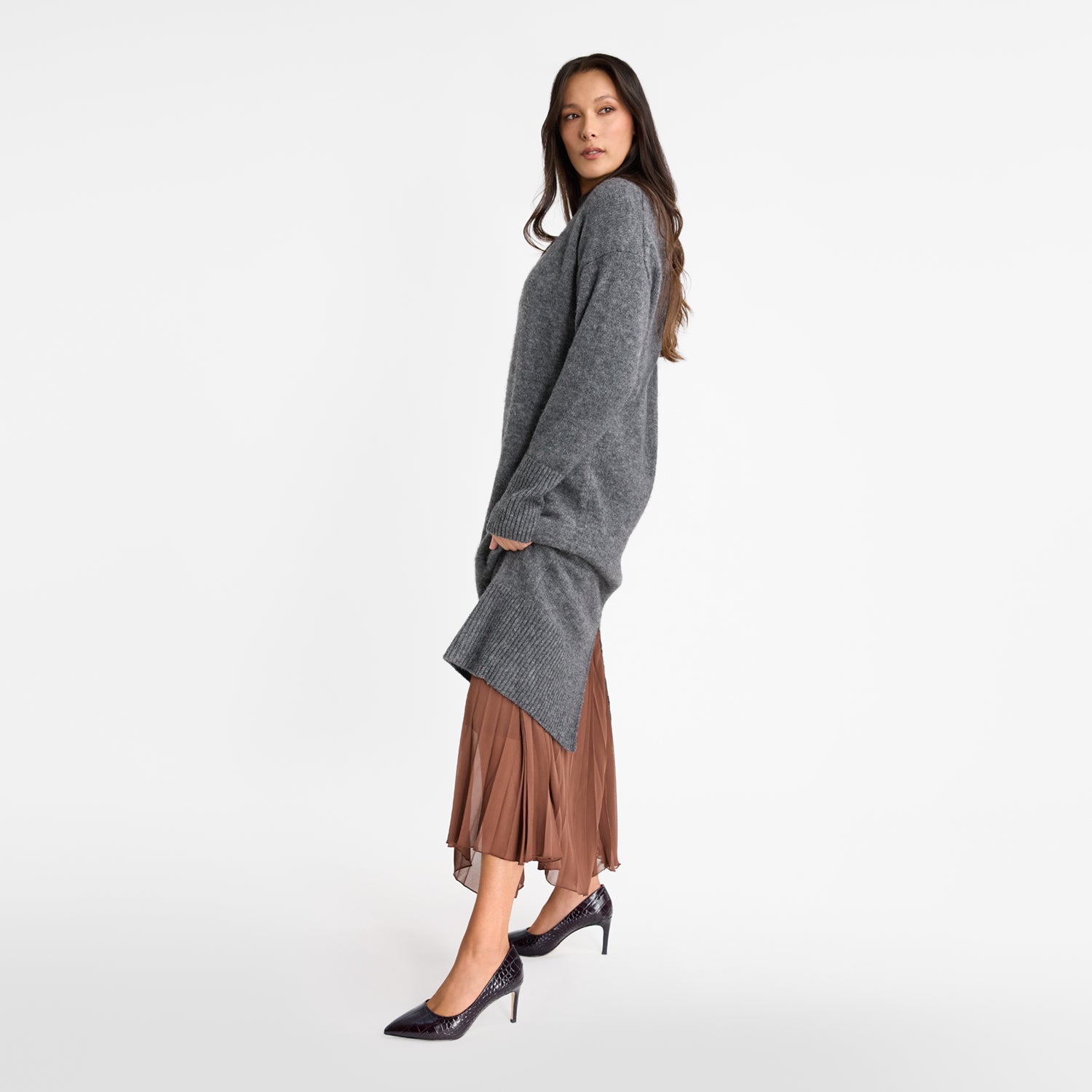 Model wears pointed Nicole Rebstock pumps.