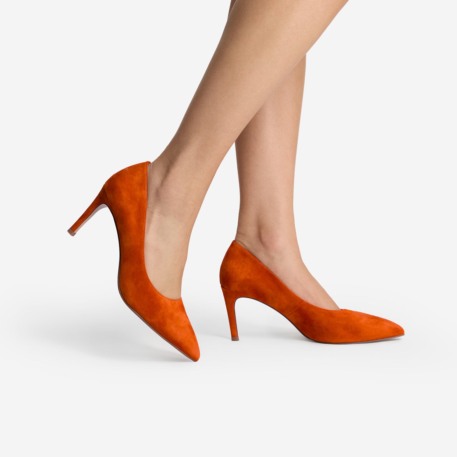 Orange high-heeled shoes on a white background