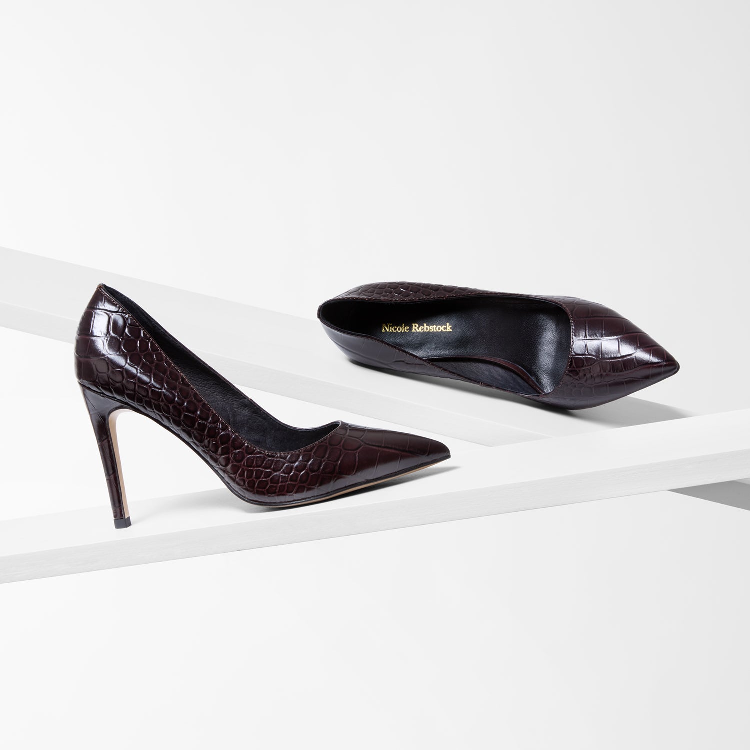 Pair of brown pointed heels with slim heel. 9.5cm heel by Nicole Rebstock
