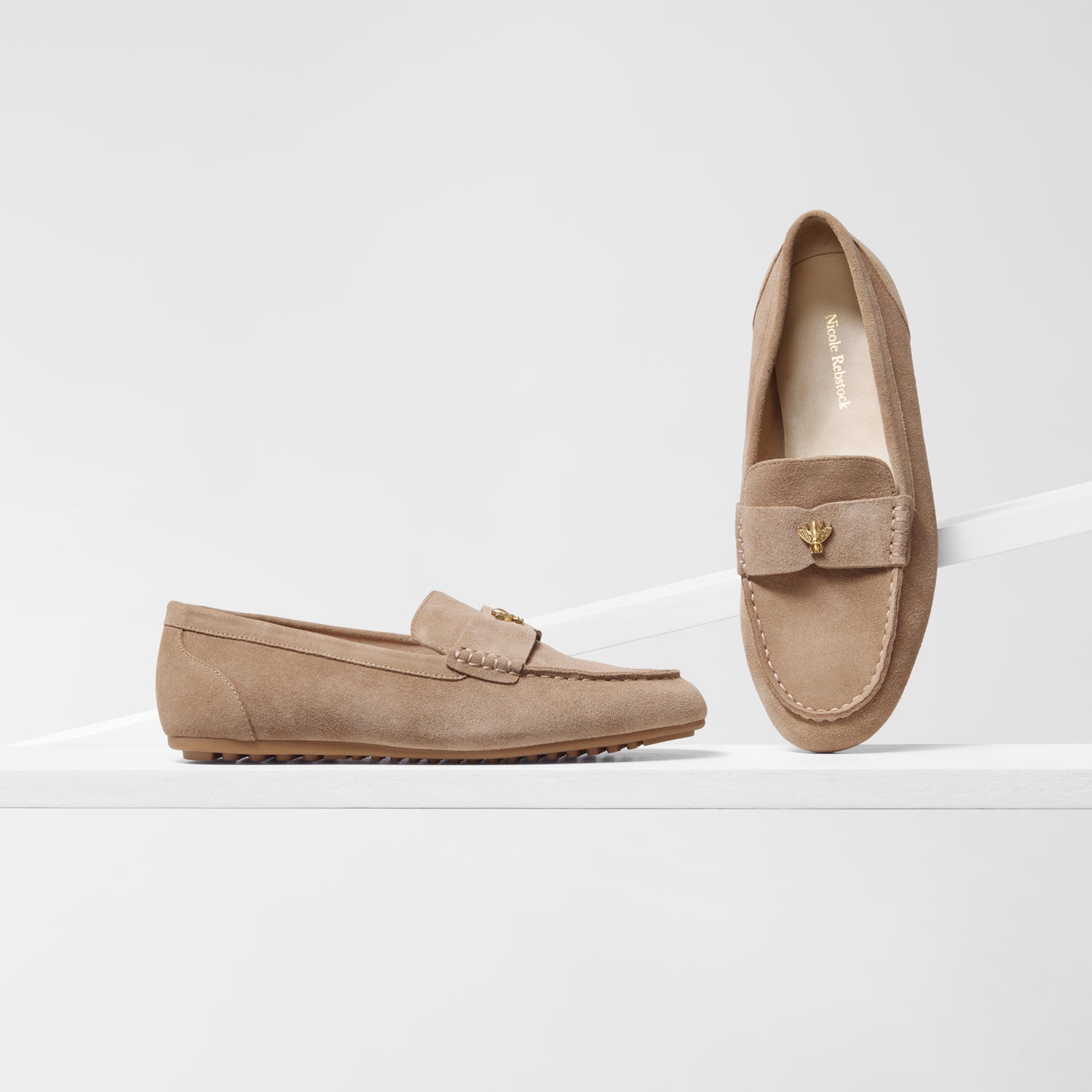 Pair of nude suede loafers with gold bee stud