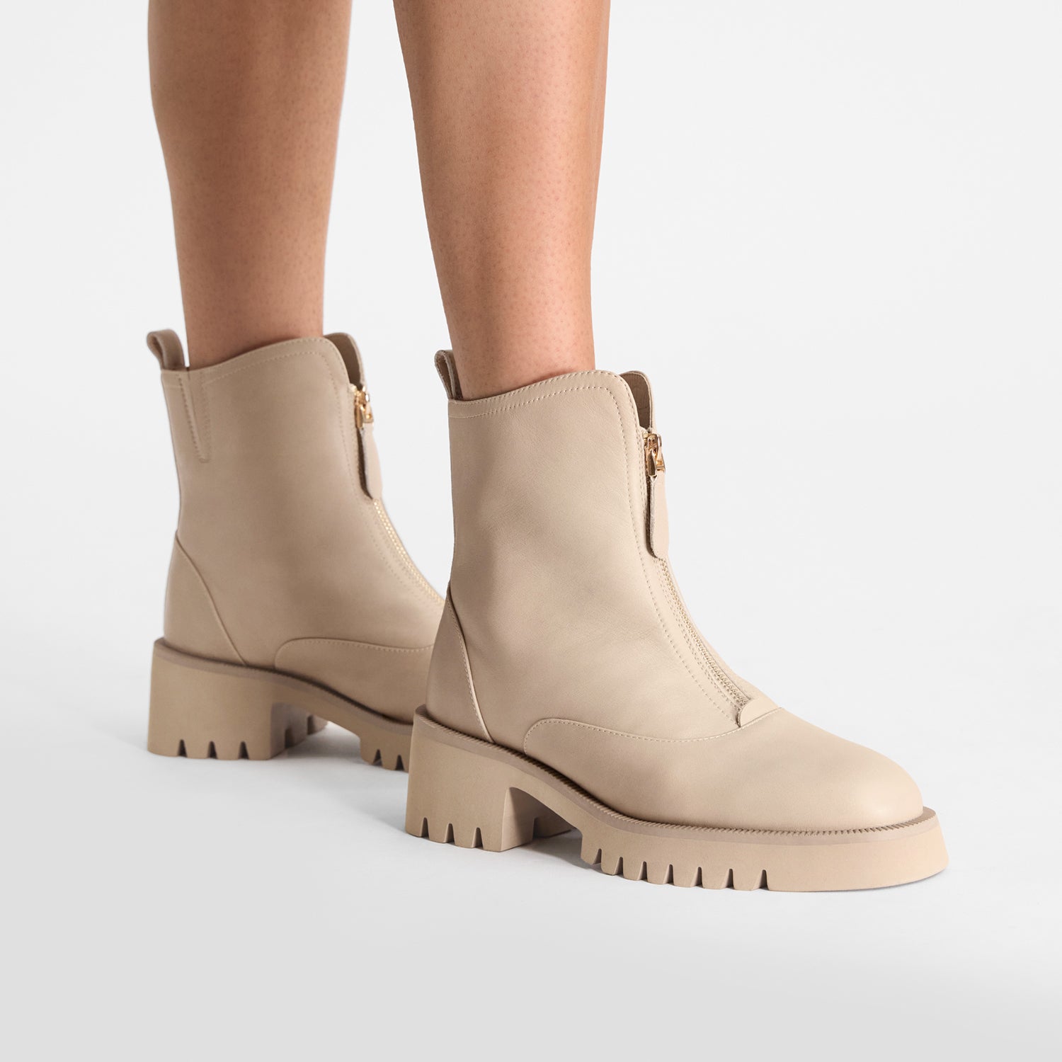 Latte ankle boots. Combat style with thick soles. Round toe.