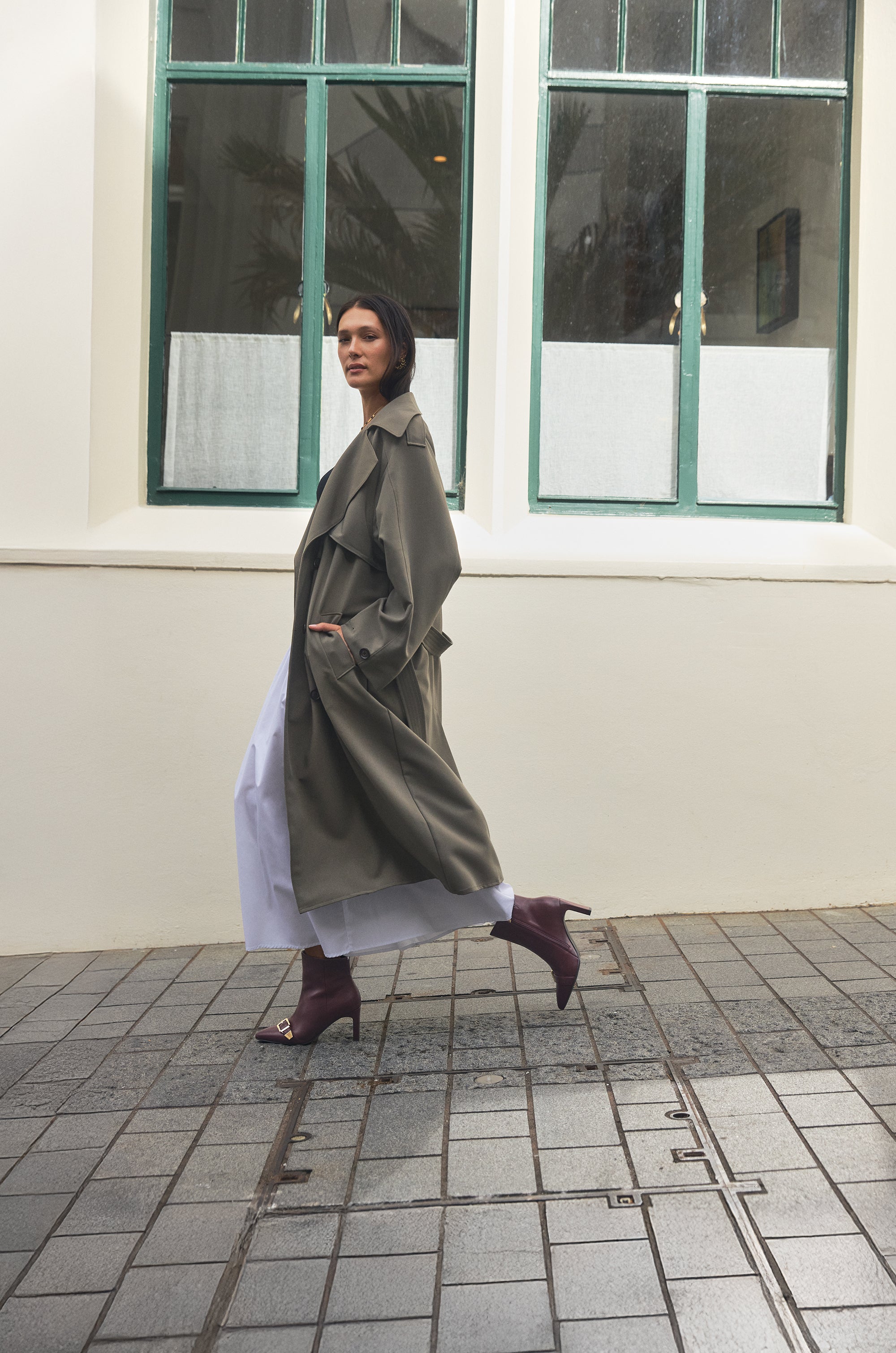Campaign imagery of Rome Oxblood Ankle Boots. Worn by woman in Auckland City.